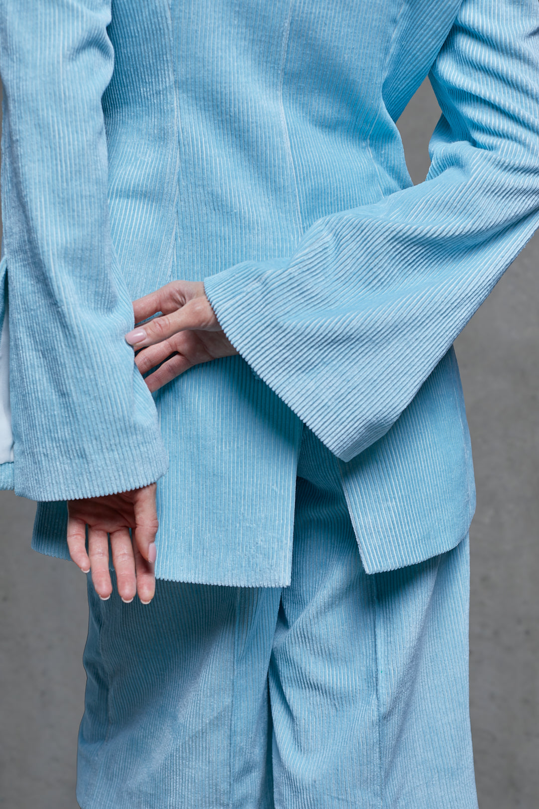 Close-up detail of SAGIO Azure velvet bermuda shorts fabric and texture.