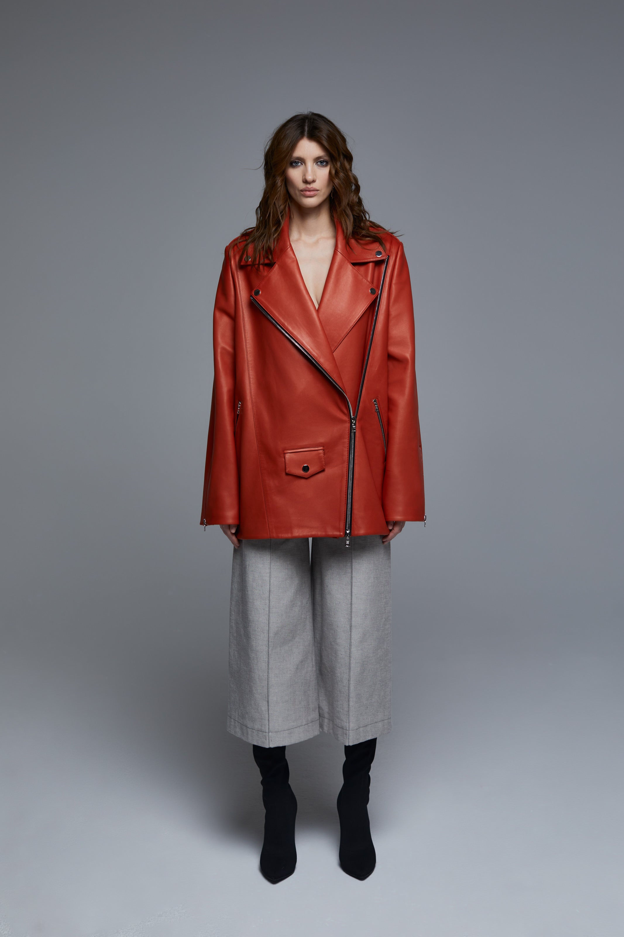 Ginger red leather biker jacket front view on model with oversized fit