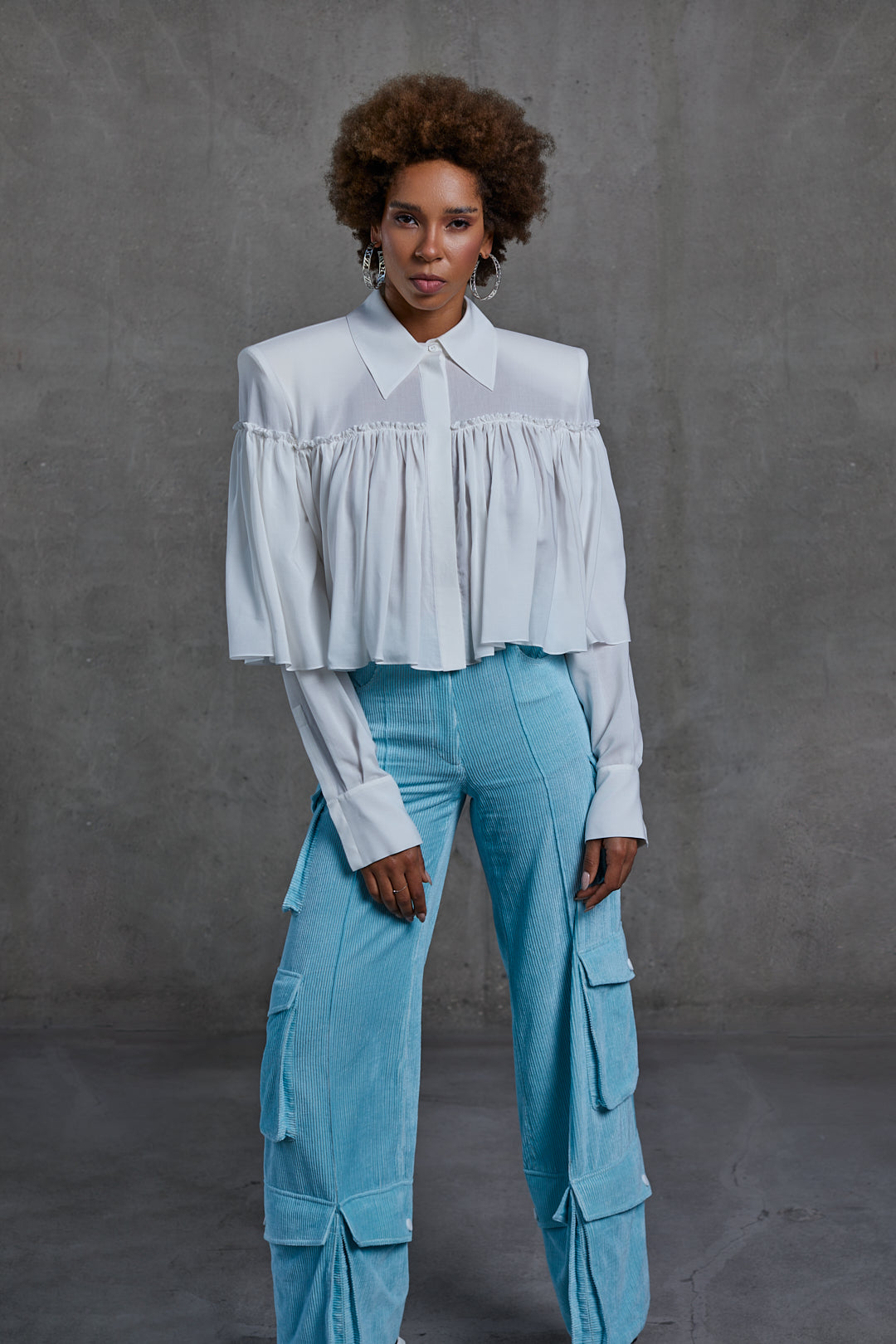 White cotton ruched blouse with padded shoulders and structured collar by SAGIO