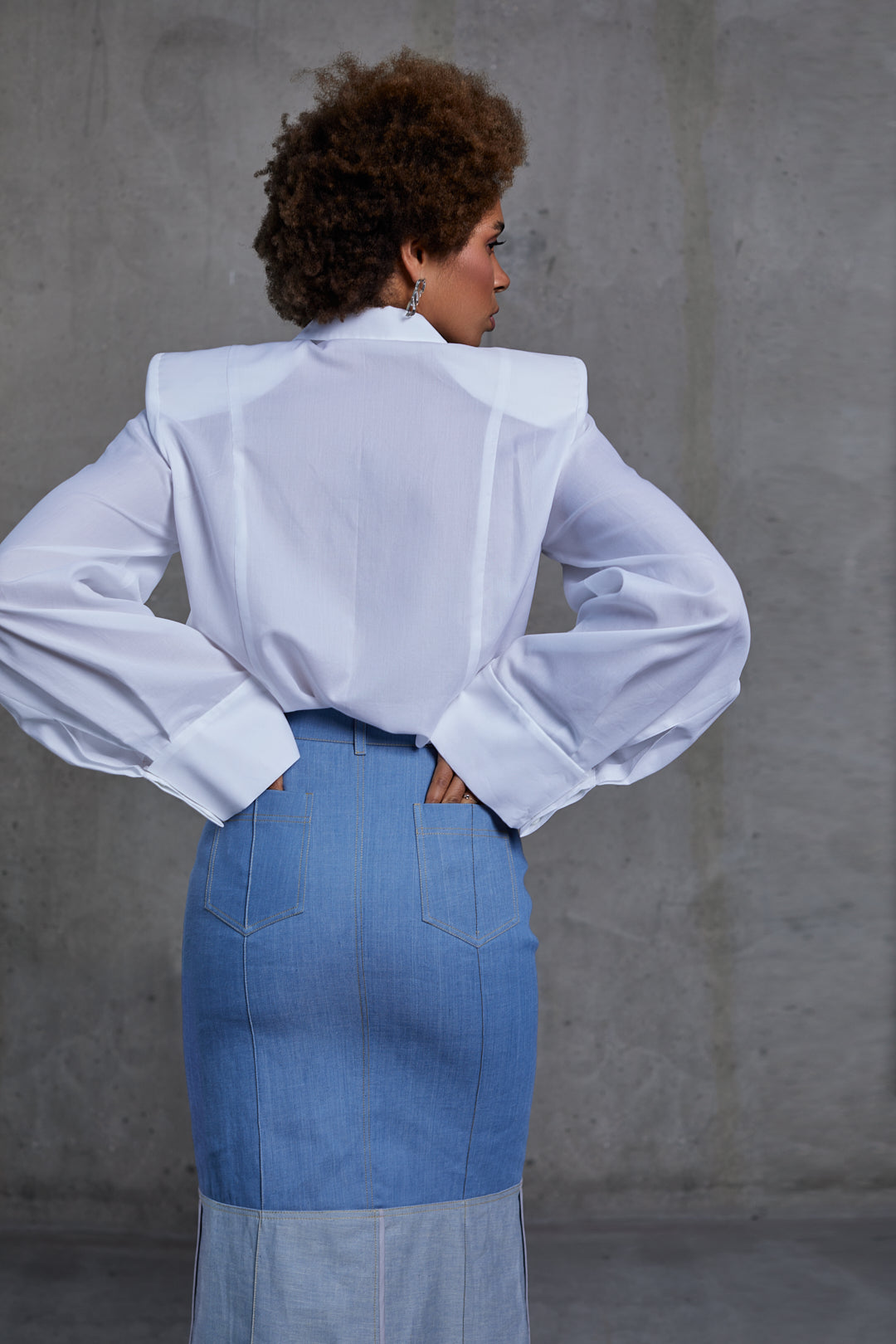White blouse, padded shoulders, back view