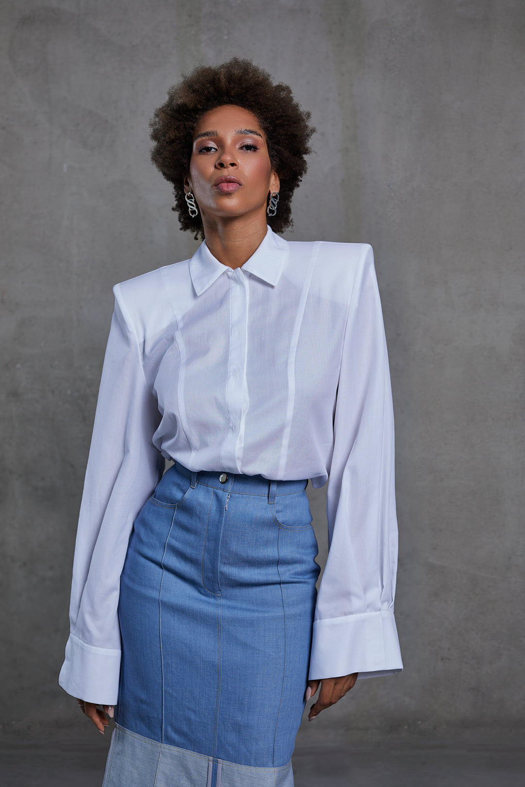 White blouse, wide cuffs and padded shoulders