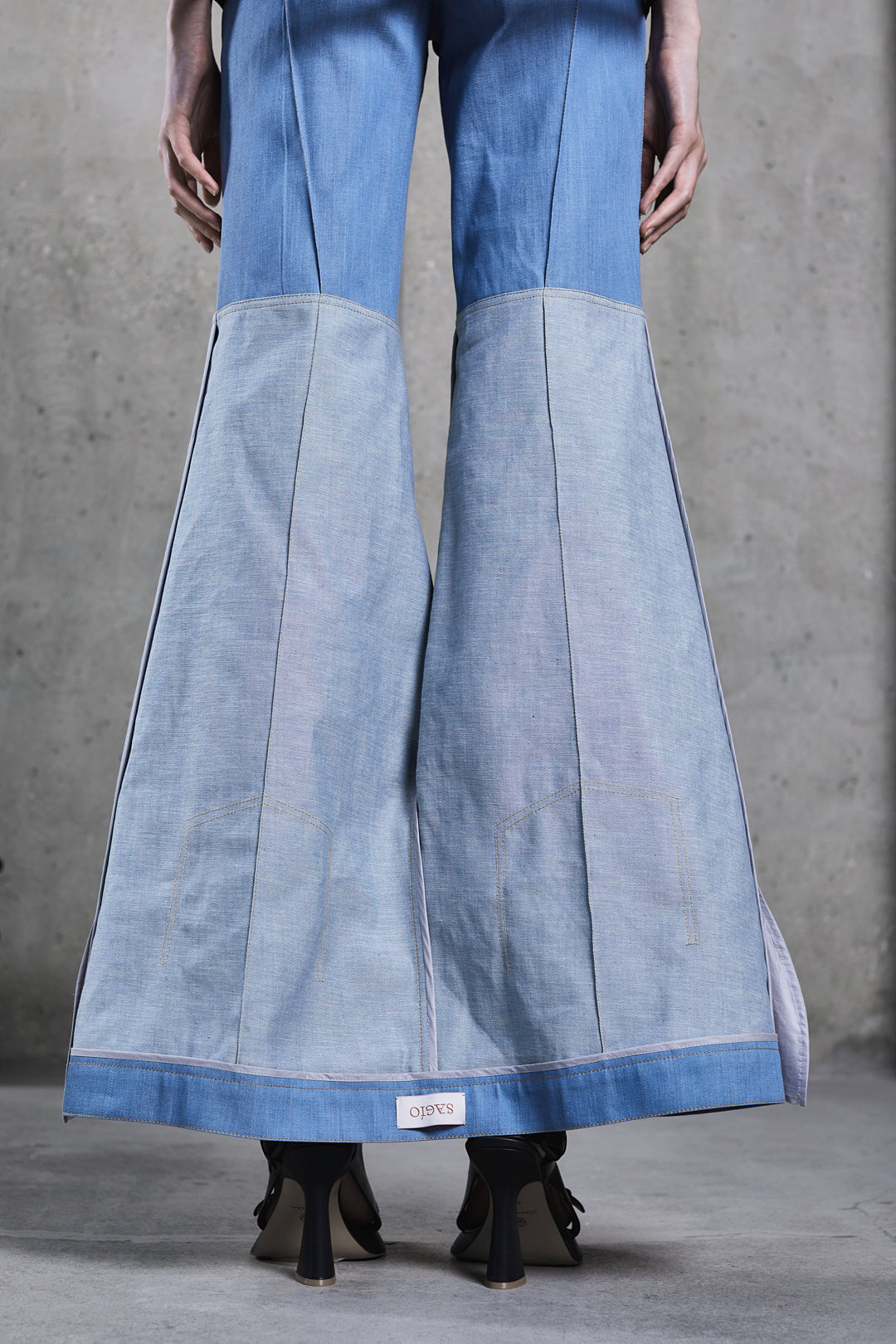 Two-tone denim flared trousers in sustainable cotton fabric by SAGIO