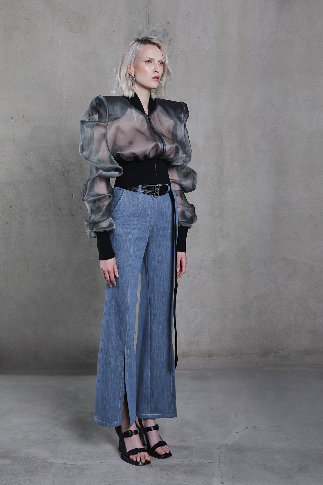 Side view, straight-fit denim trousers showing frontal slit detail