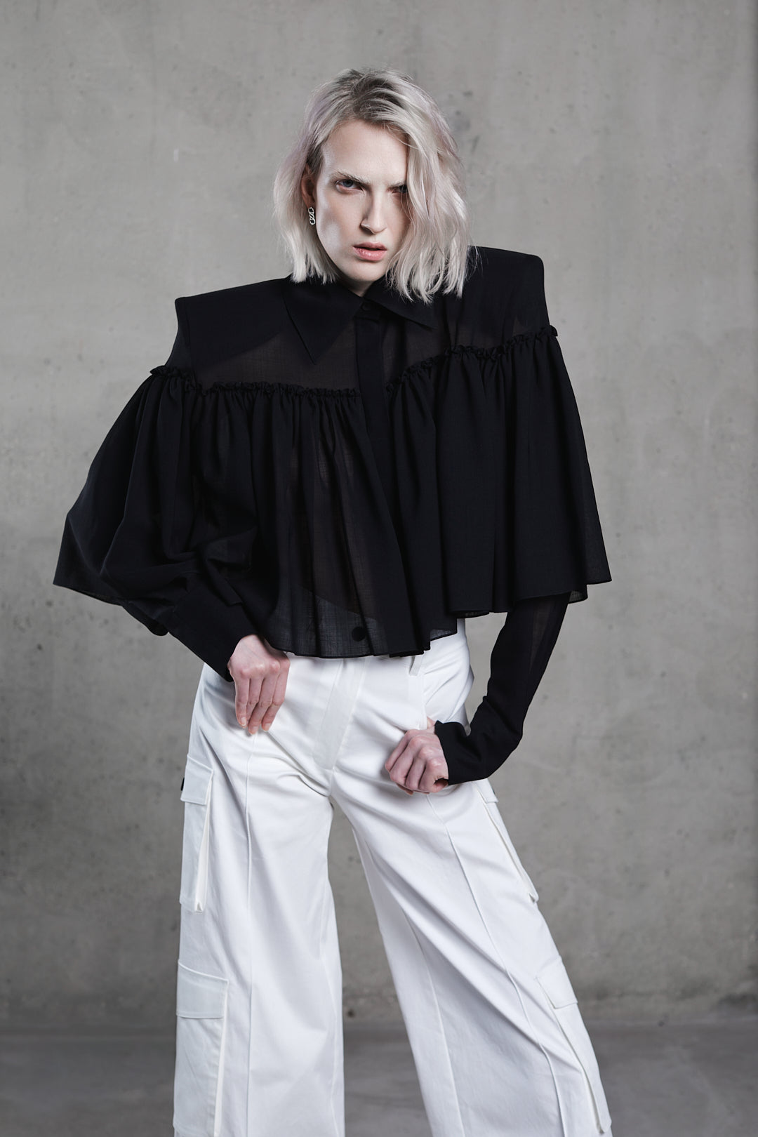 SAGIO designer black blouse with voluminous silhouette and long sleeves, front view