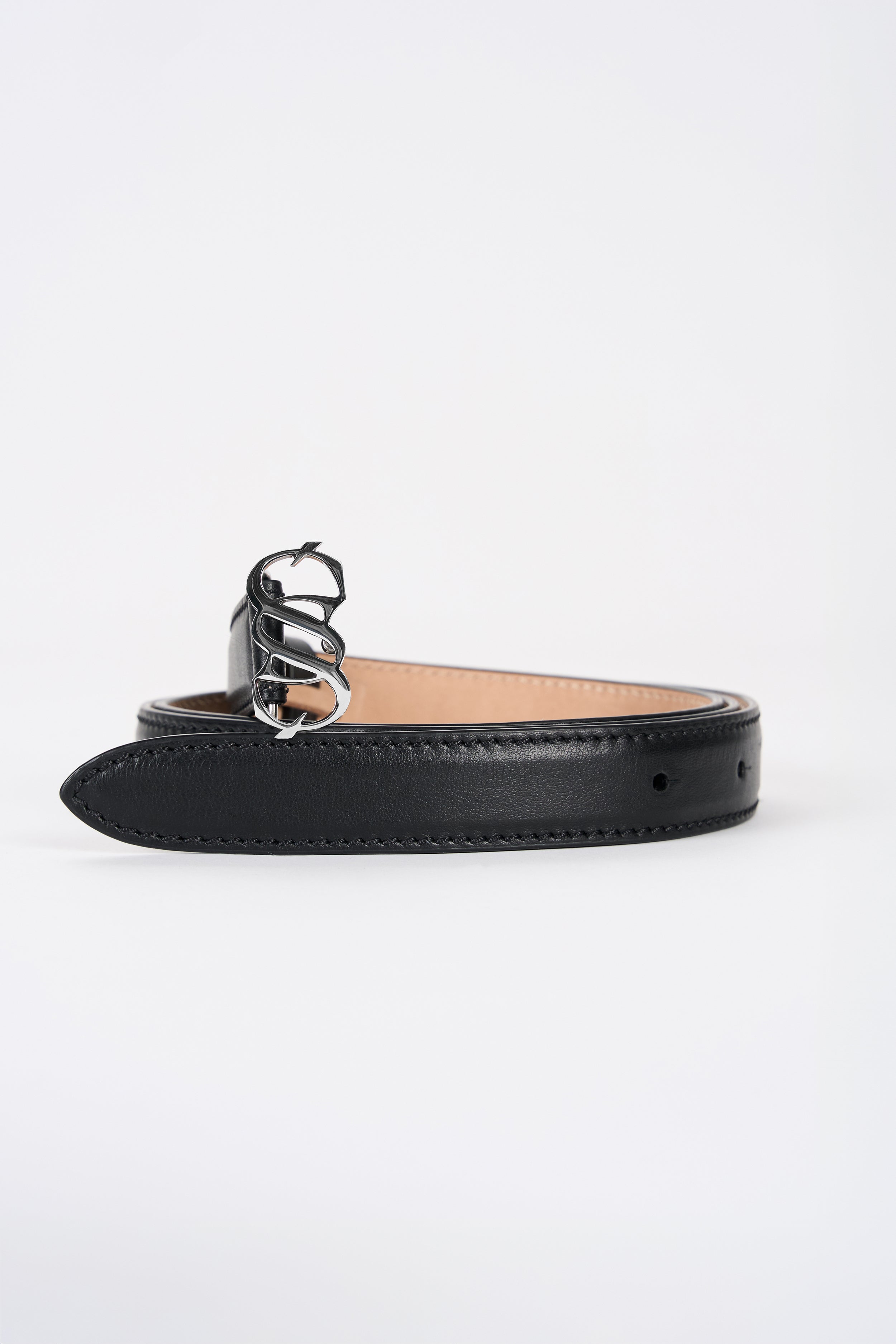 Black leather monogram belt with silver-tone buckle, angled view