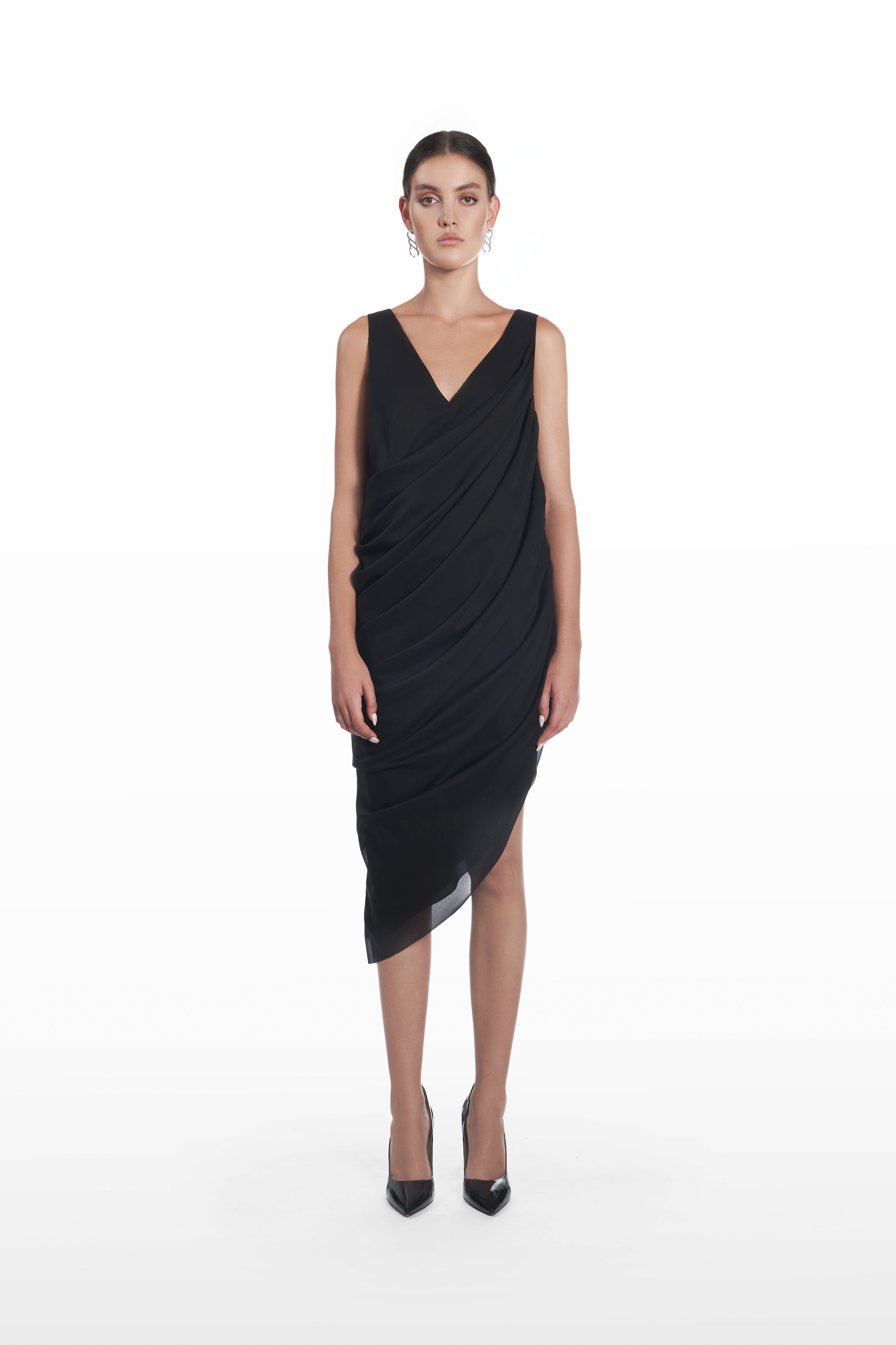 Stola Silk Dress in Black, front view, sleeveless draped silk midi dress with V-neckline, asymmetric hem and fluid sculptural silhouette