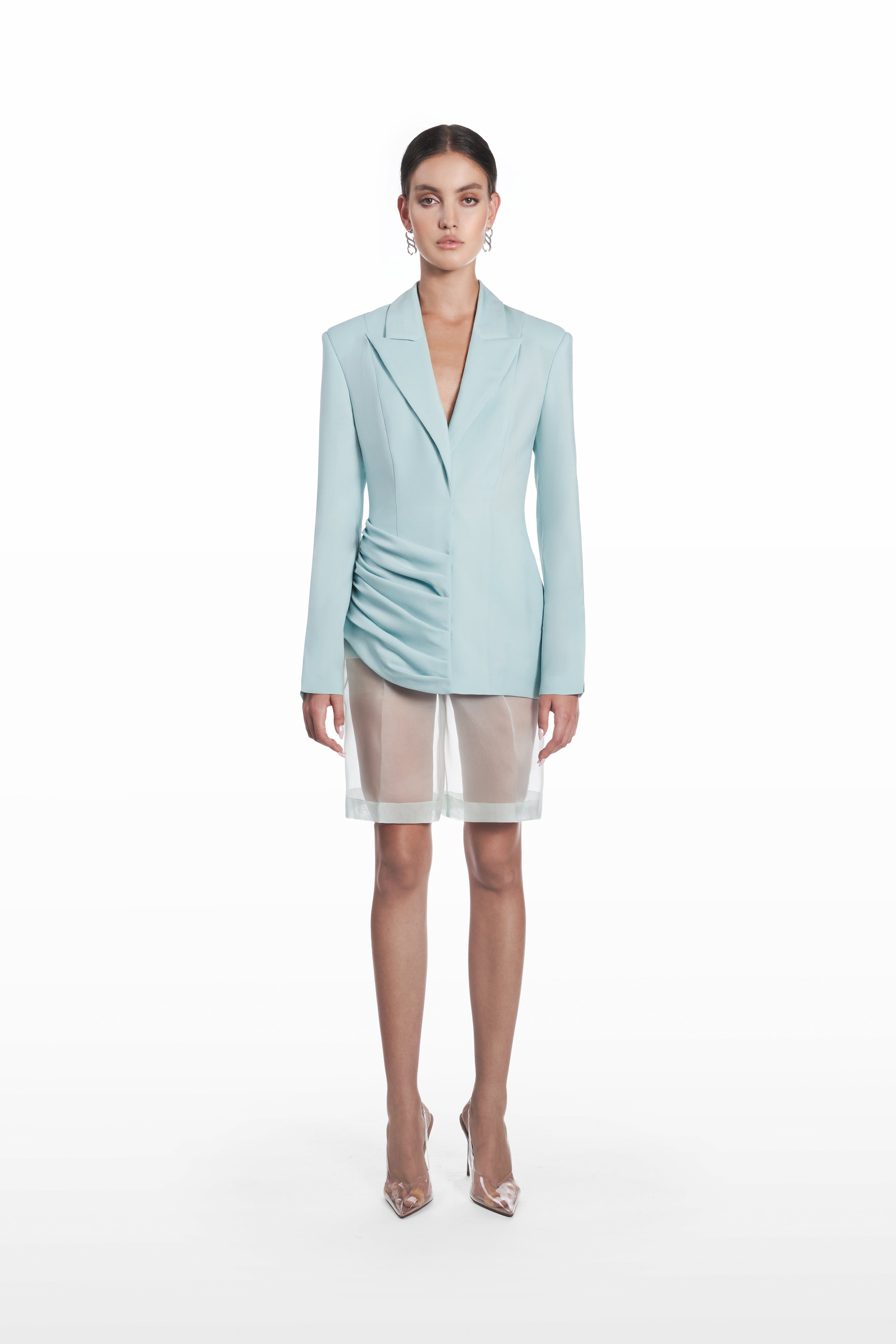 Palla Classic Blazer in light blue virgin wool, front view with sculptural shoulders and asymmetric gathered waist detail