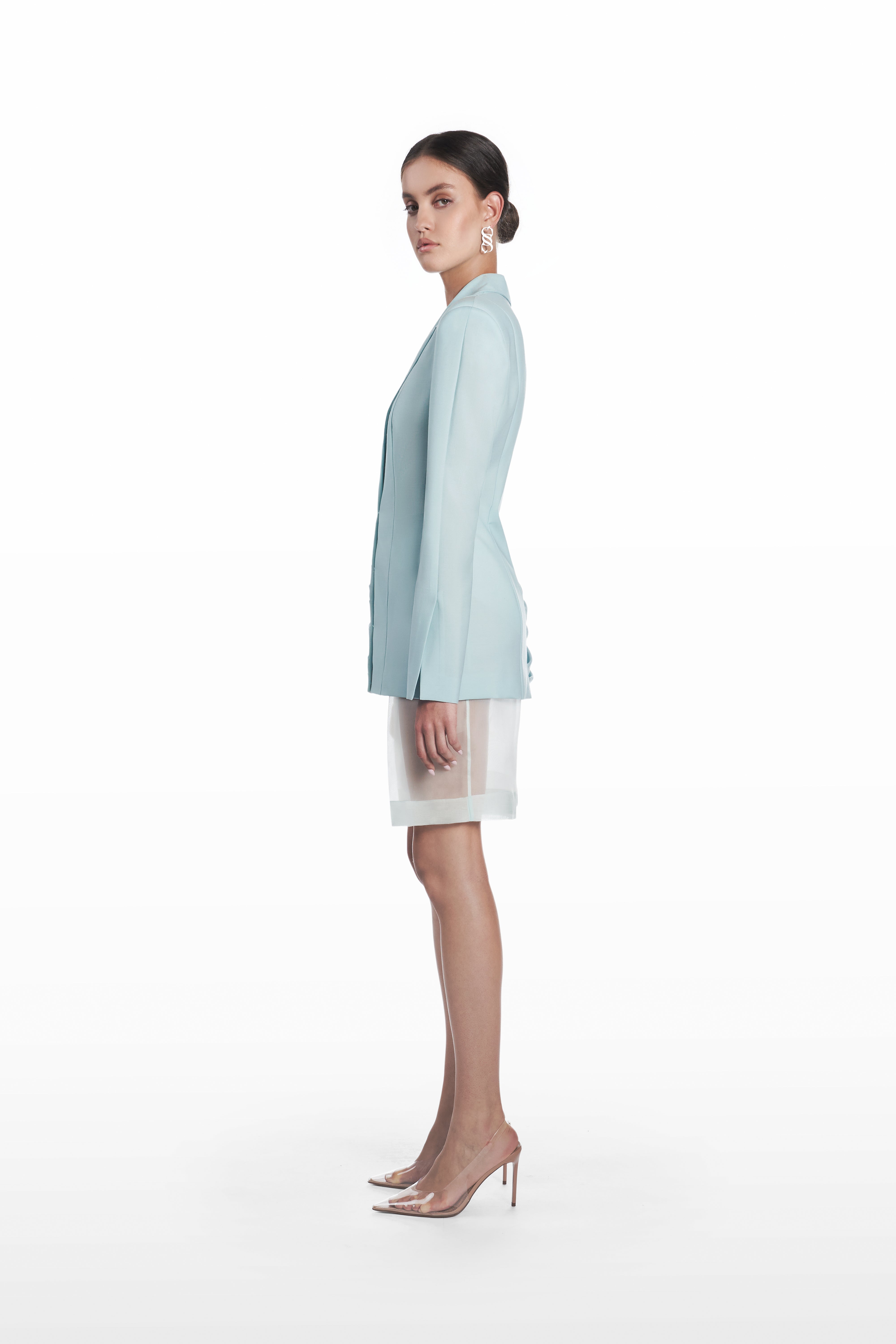 Palla Classic Blazer in light blue virgin wool, side view showing elongated tailored silhouette and draped side construction