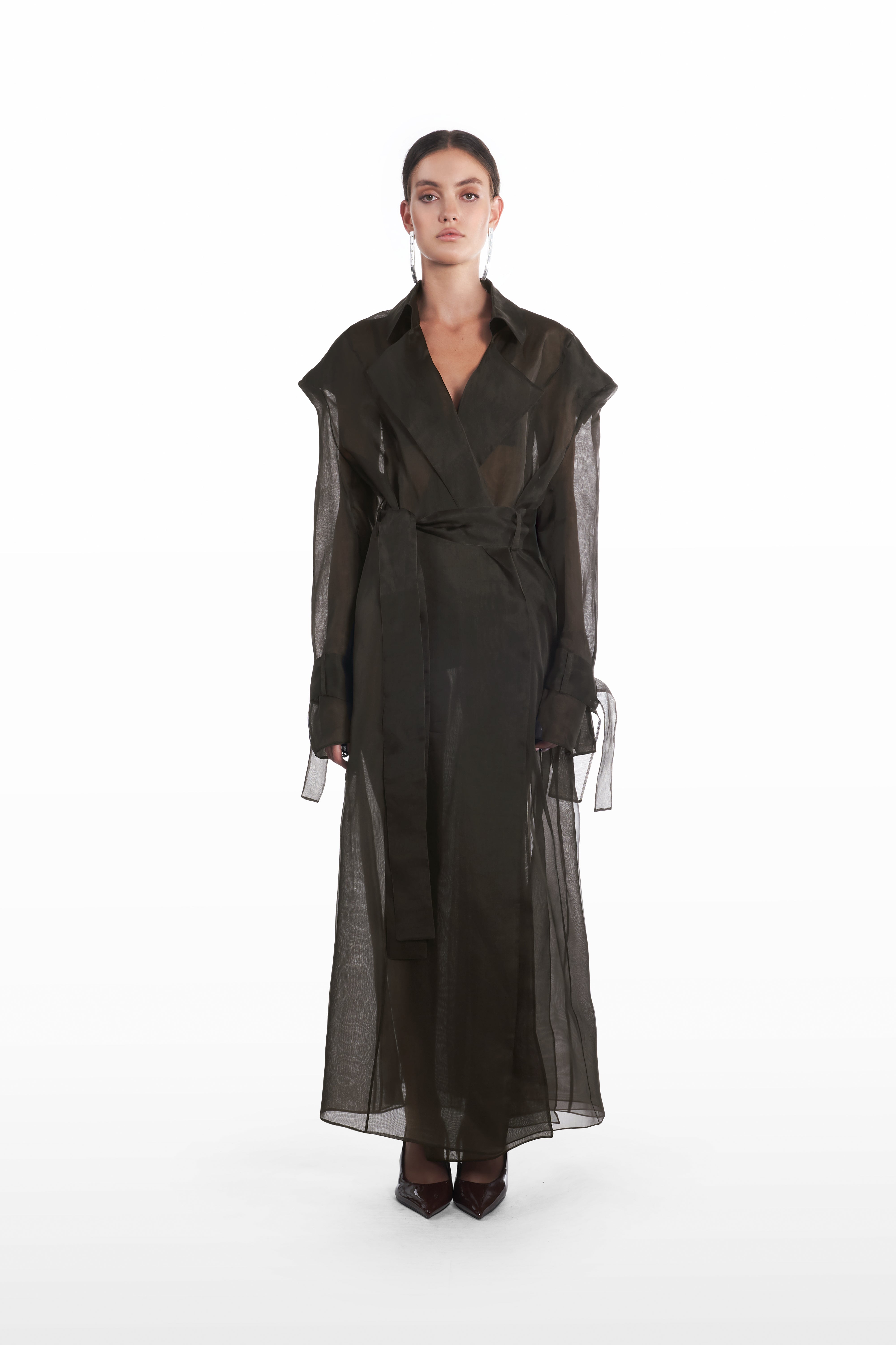 Classic double organza trench in black, front view with belted waist and sheer full-length silhouette