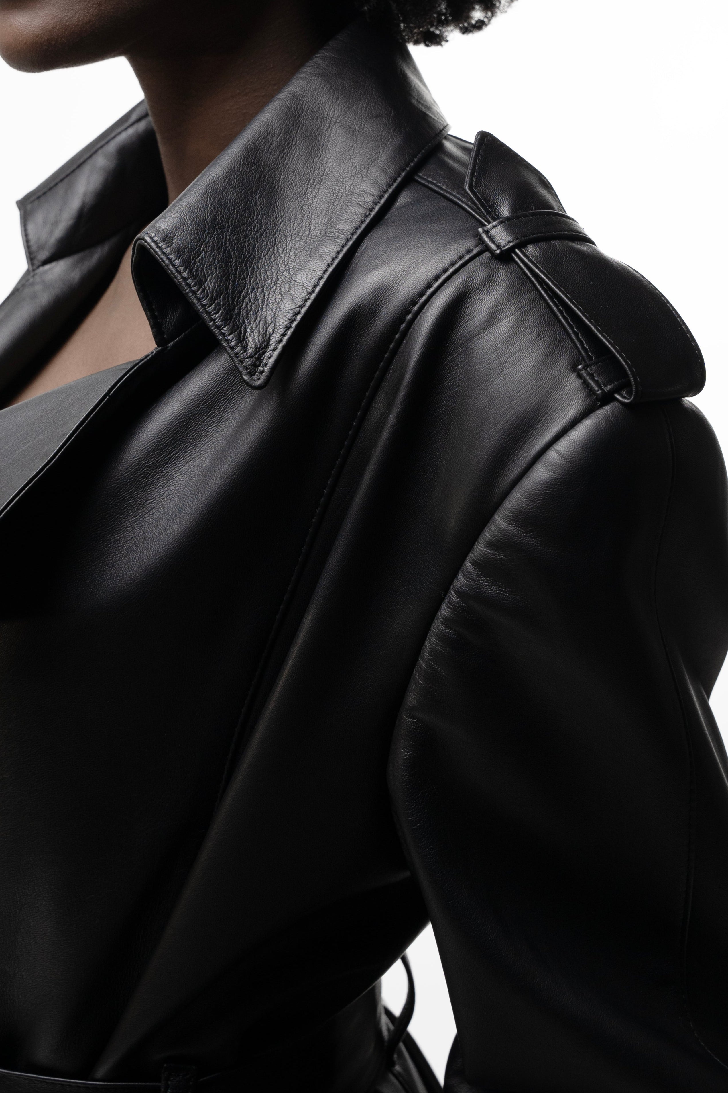 Close-up of collar, wide lapels and shoulder epaulette in black leather