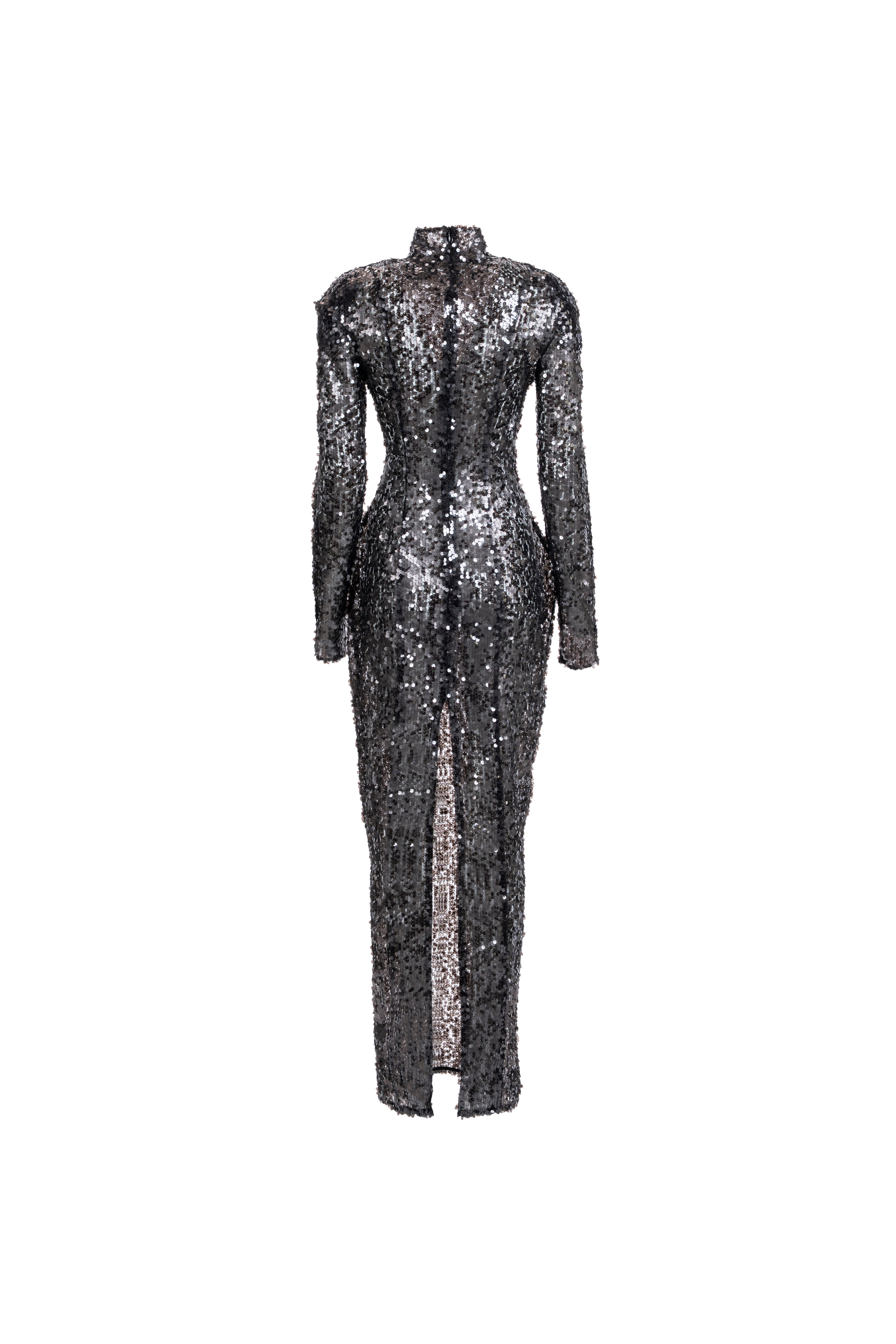 Long-sleeve high-neck black sequin column dress, back view with center slit.