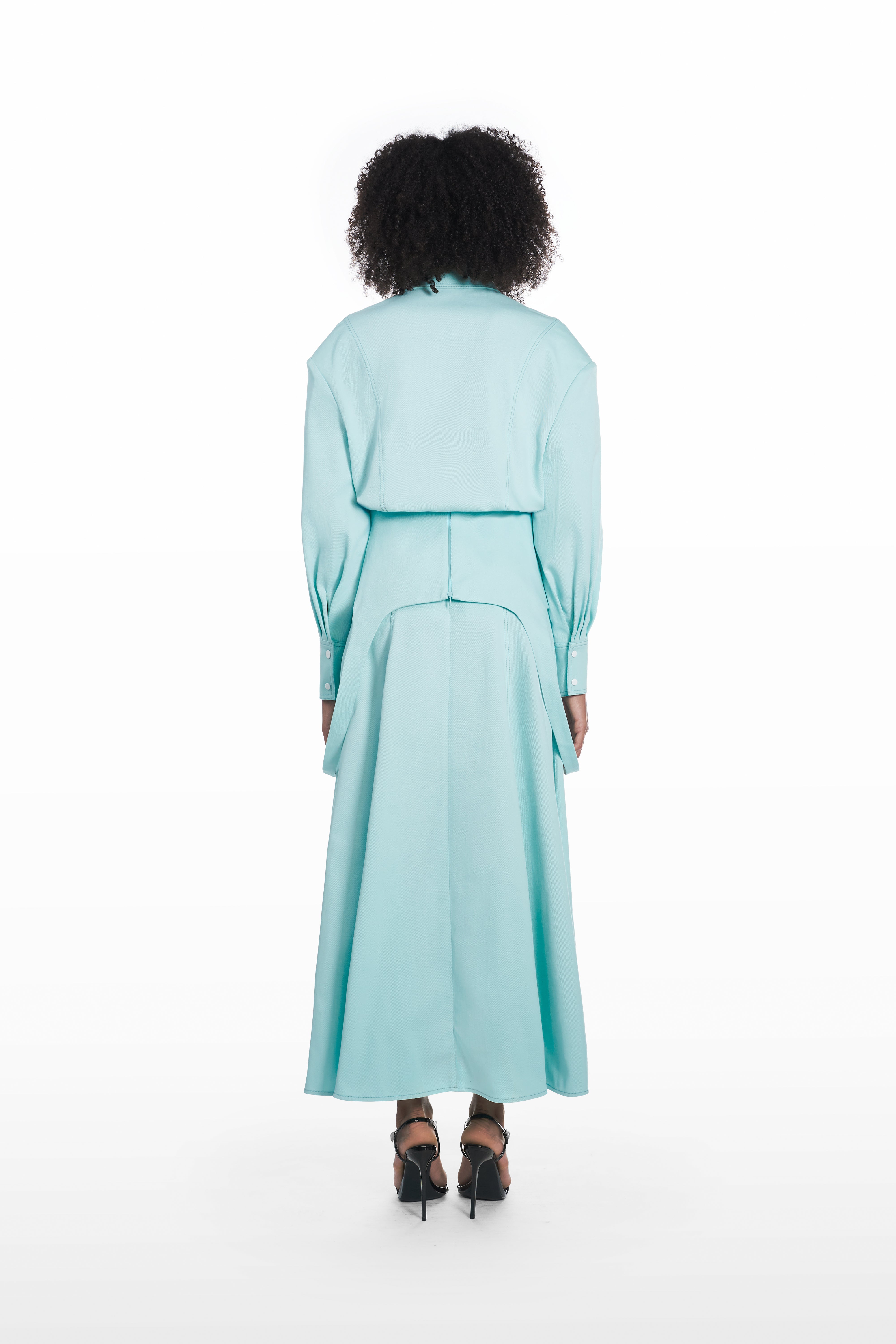 Falling maxi skirt in clear aqua, back view with fluid maxi silhouette and clean architectural fall styled with a matching blouse