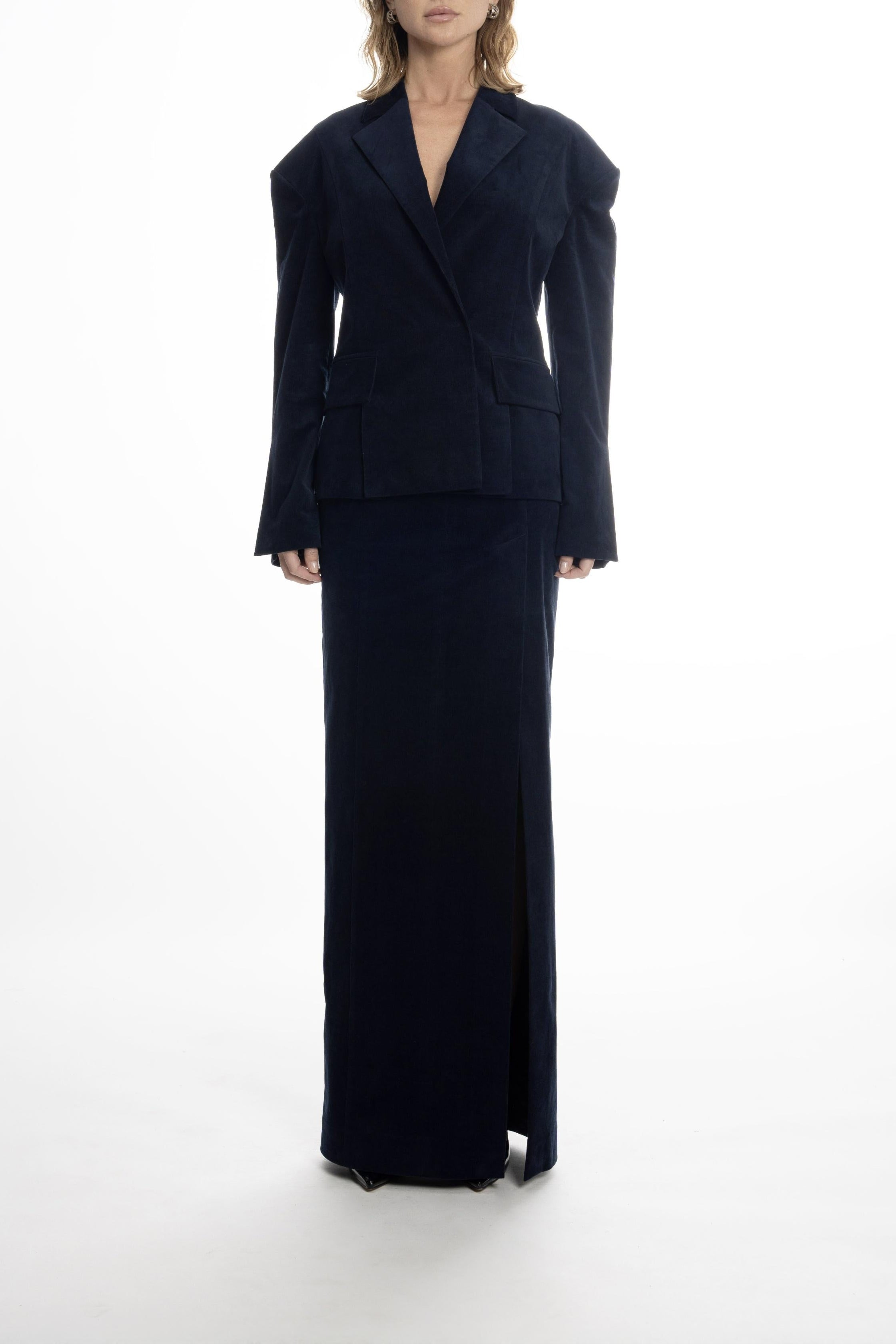 Burgundy long cotton skirt showing straight column silhouette.
