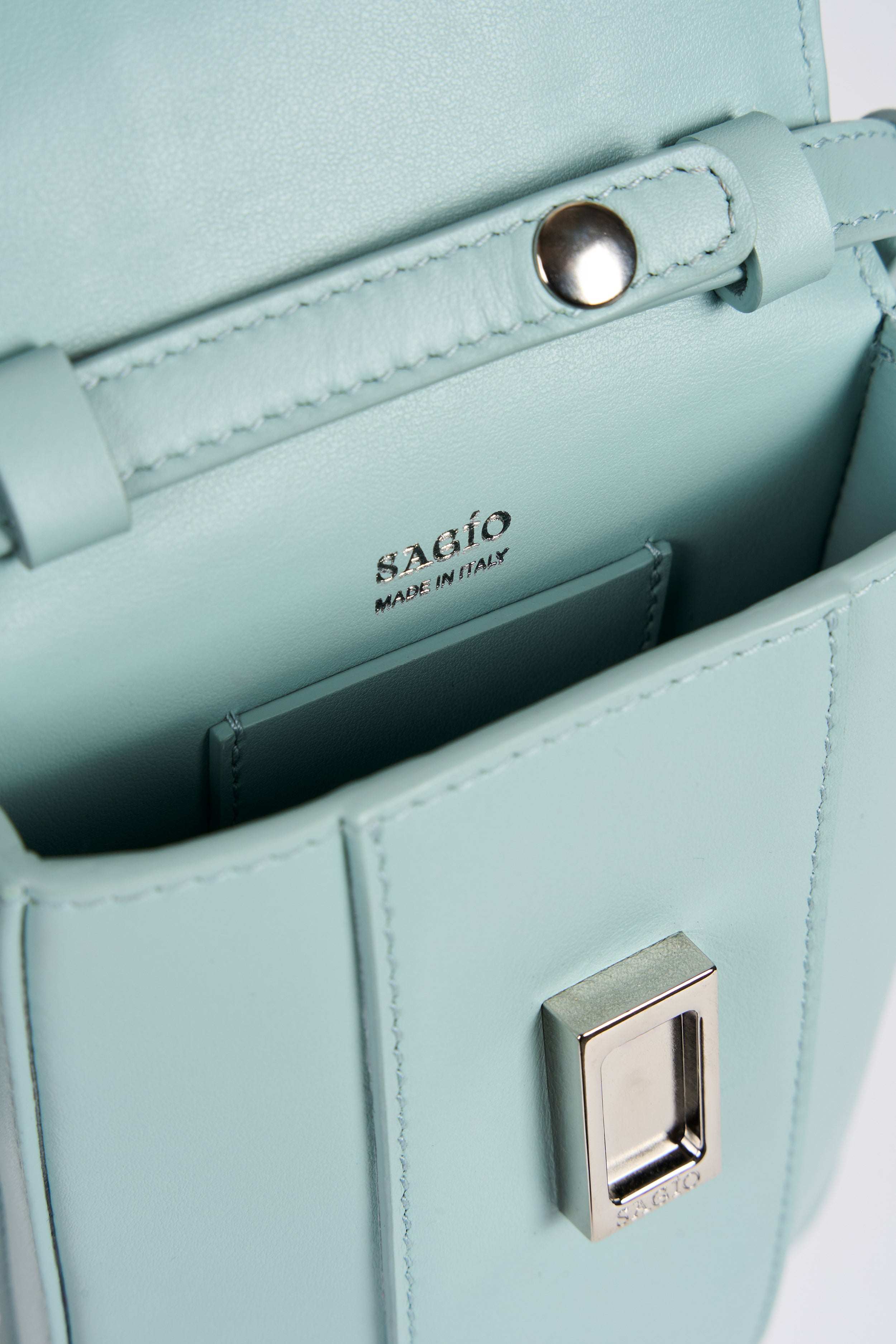 Clear aqua Il Cupolina bag interior detail in Italian leather with silver-tone clasp and logo stamp