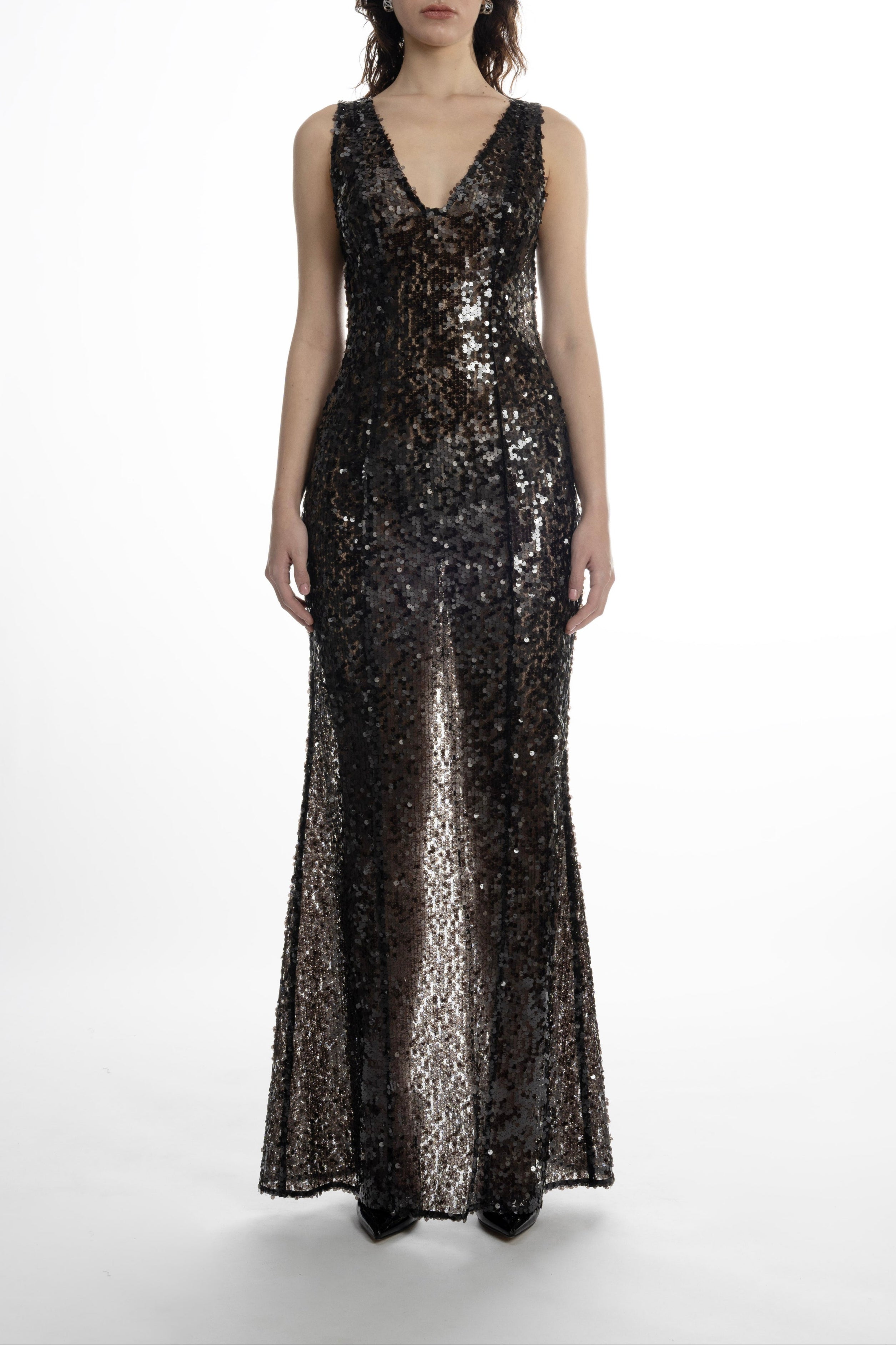 Woman in black Naked Shimmer Dress, plunging V-neck and full-length sequin finish
