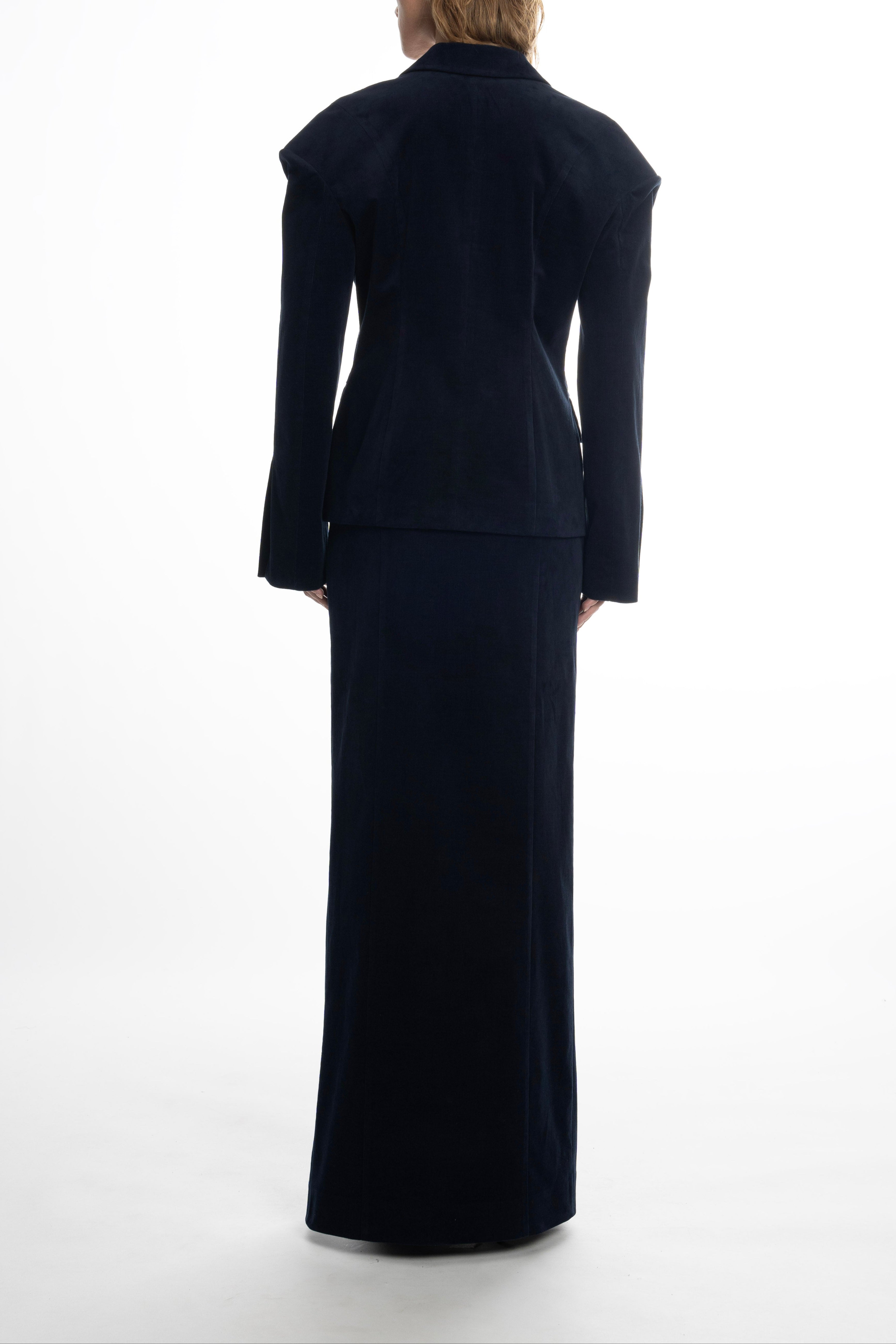 Woman in navy Falling Shoulders blazer emphasizing shoulder drop
