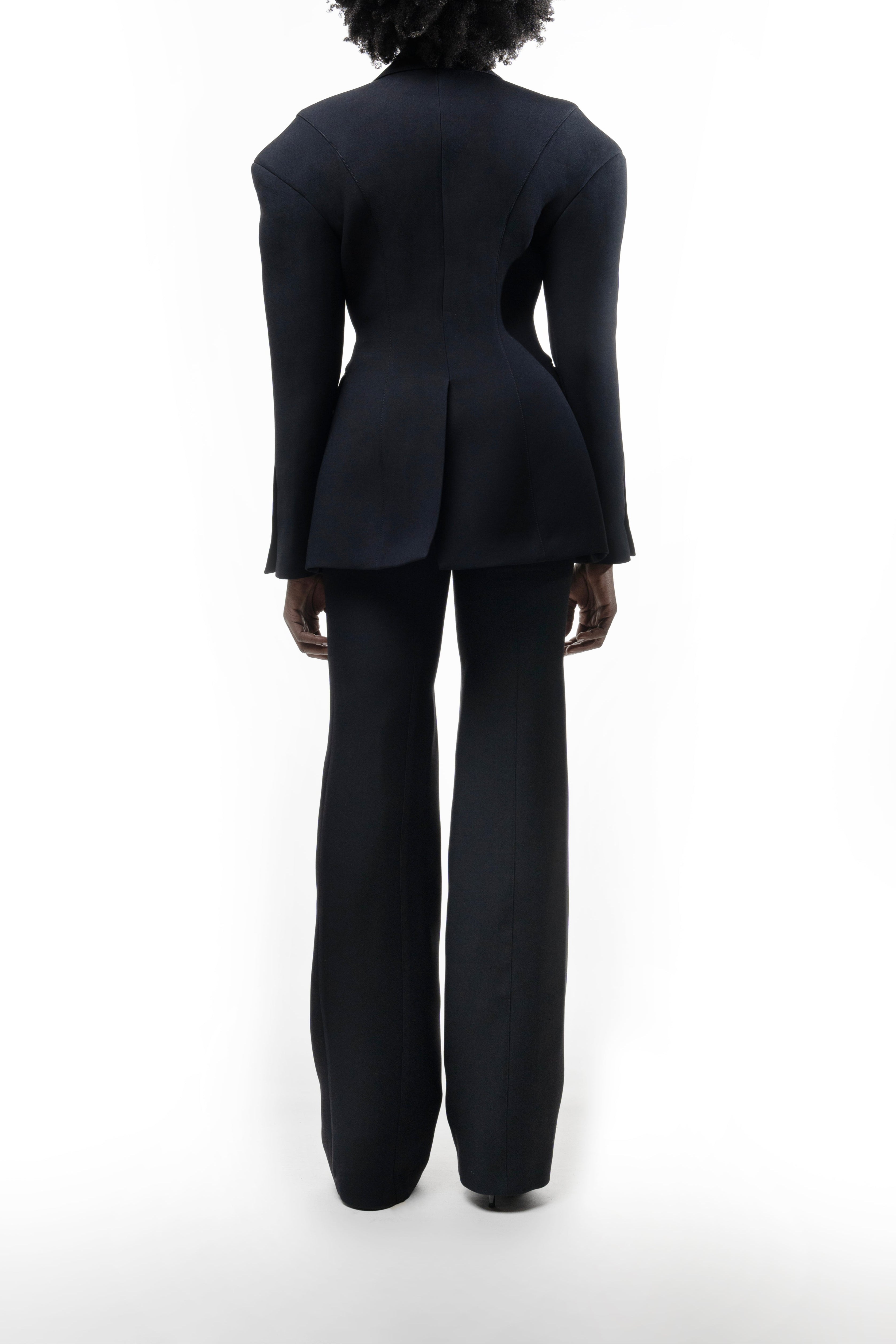 Falling Shoulders Jacket, dropped-shoulder tailoring with contoured seams, center vent and flared hem for fluid shape