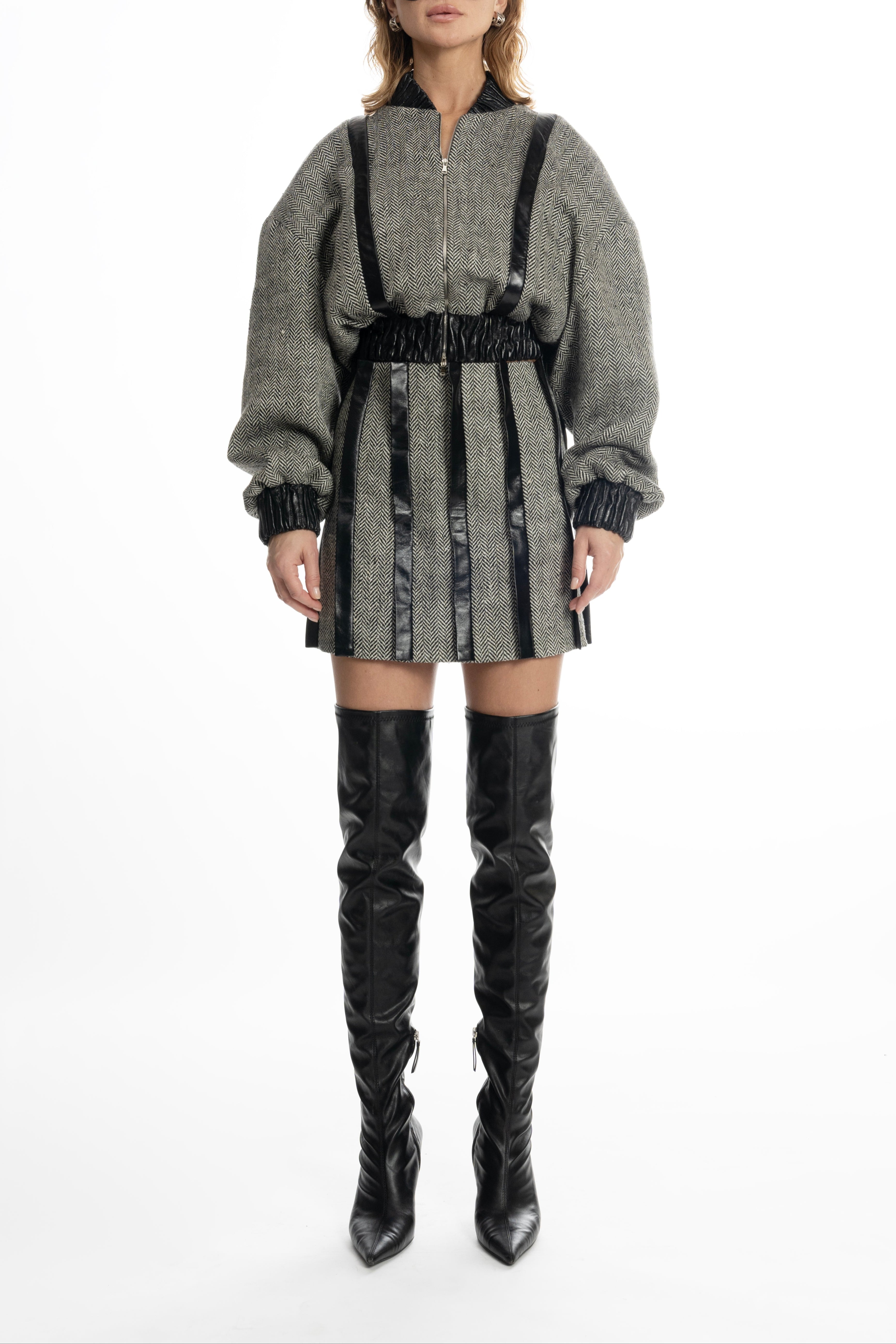 Women’s grey tweed bomber jacket with leather trims and sculptural sleeves, front view on model