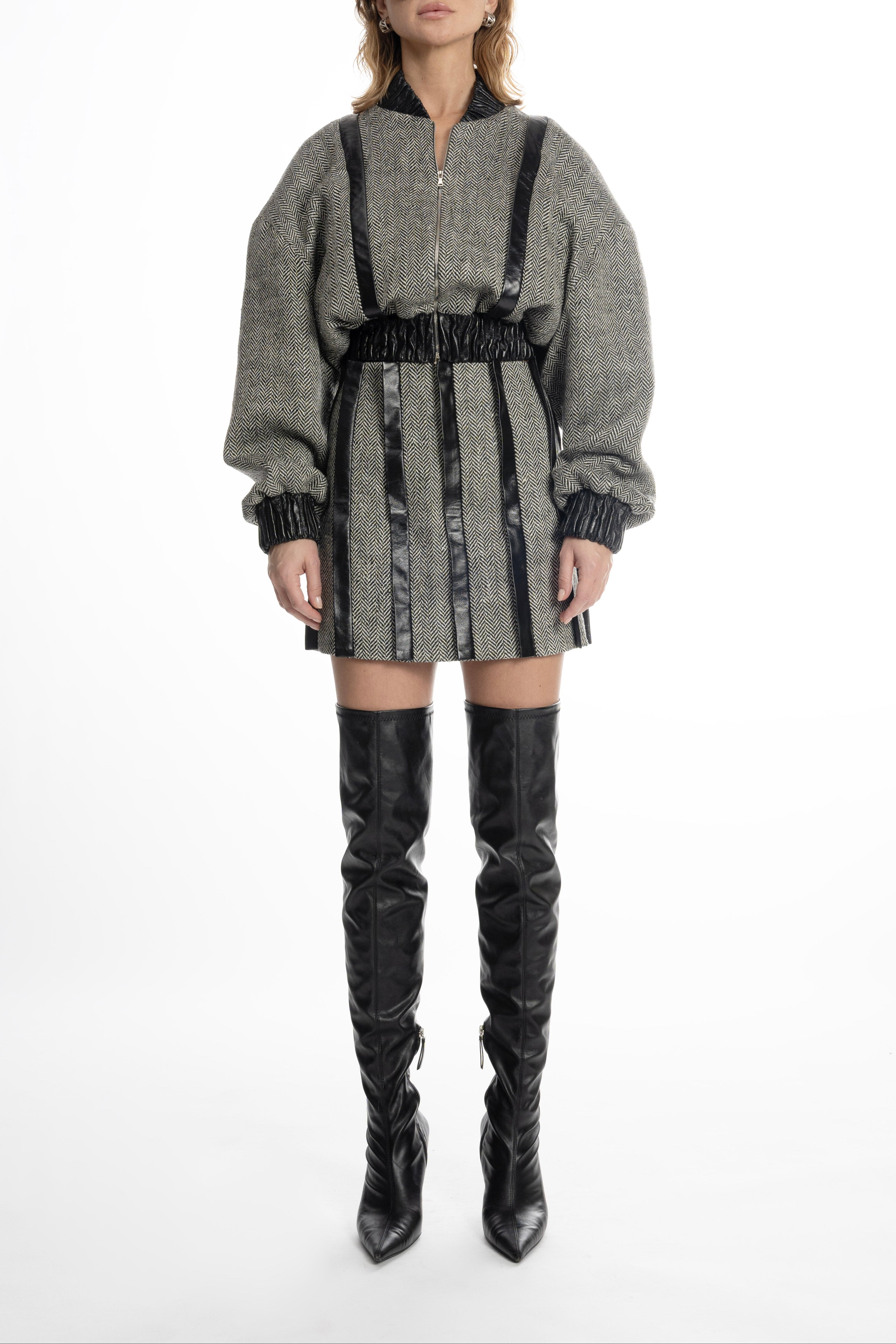 Women’s grey tweed mini skirt with leather placket stripes, front view on model