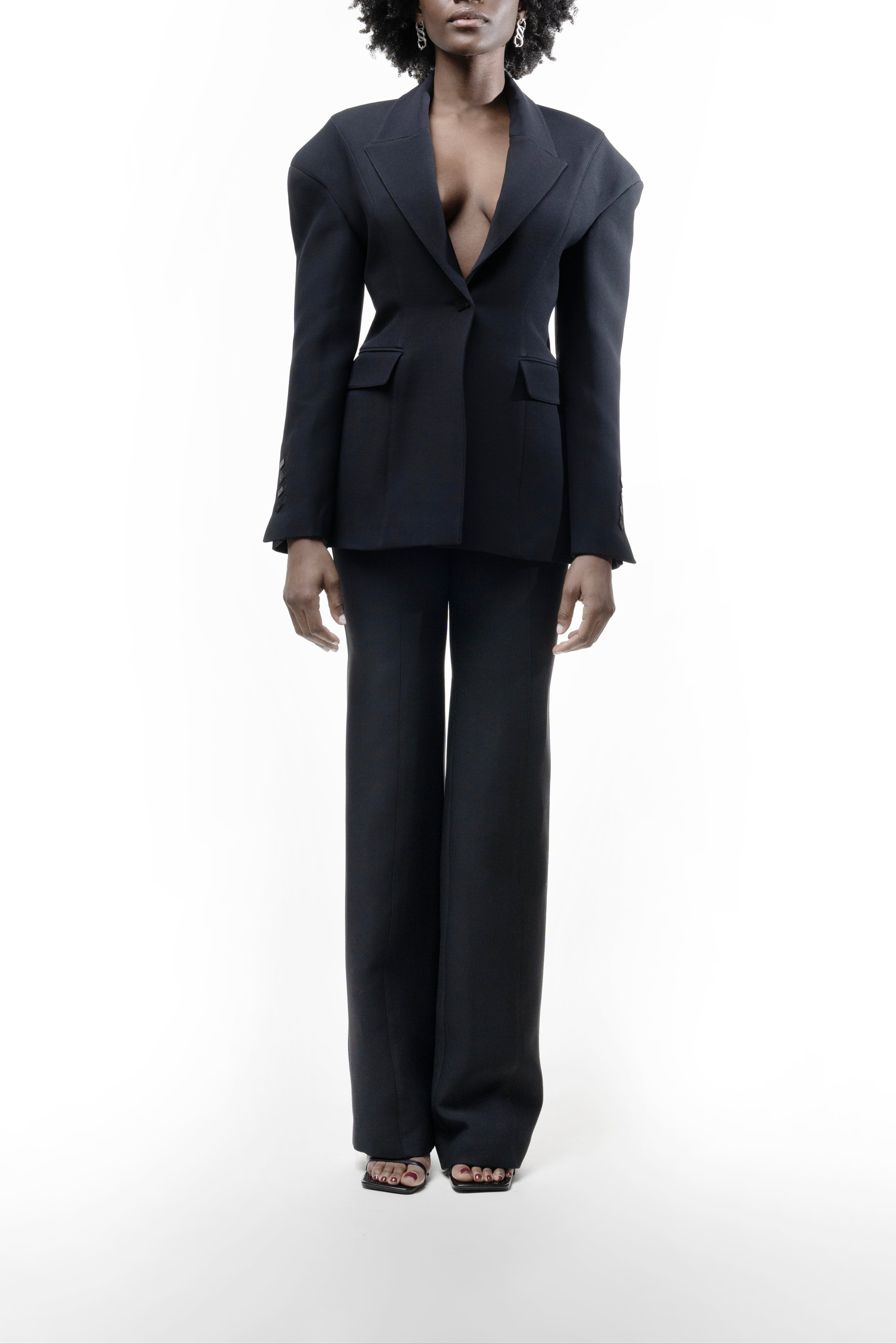 Black Falling Shoulders Jacket, single-breasted with sharp lapels, flap pockets and relaxed shoulders, styled with straight trousers