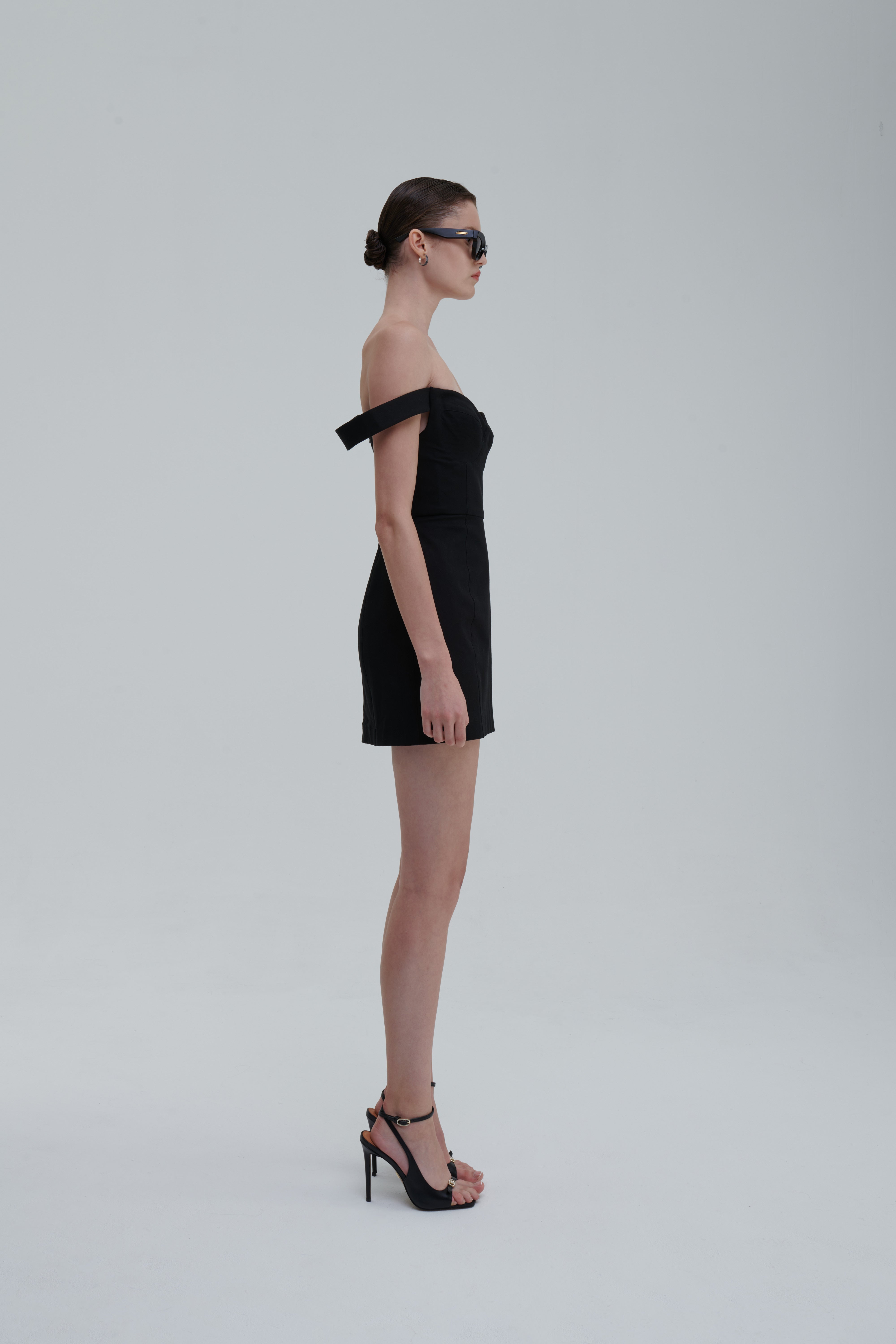 FALLING STRAPS DRESS by Sagio from the Spring/Summer 2025 collection — an asymmetrical black dress with layered falling straps, a fitted bodice, and deconstructed detailing. Bold conceptual eveningwear from thesagio.com.