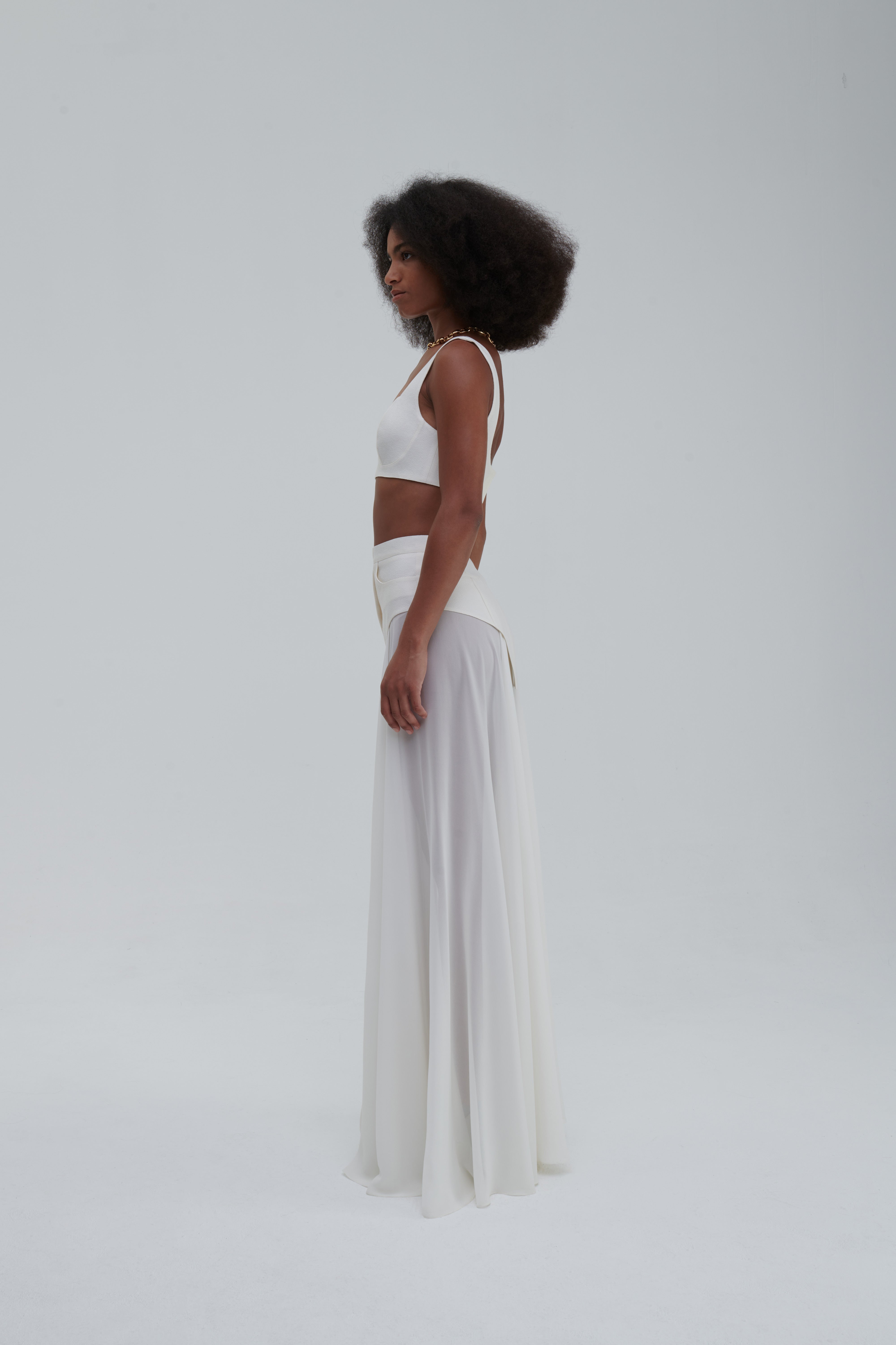 MAXI UNDERWEAR APPLICATION SKIRT by Sagio from the Spring/Summer 2025 collection — a sheer white maxi skirt featuring underwear-inspired paneling and elegant draping. Conceptual designer fashion in lightweight fabric from thesagio.com