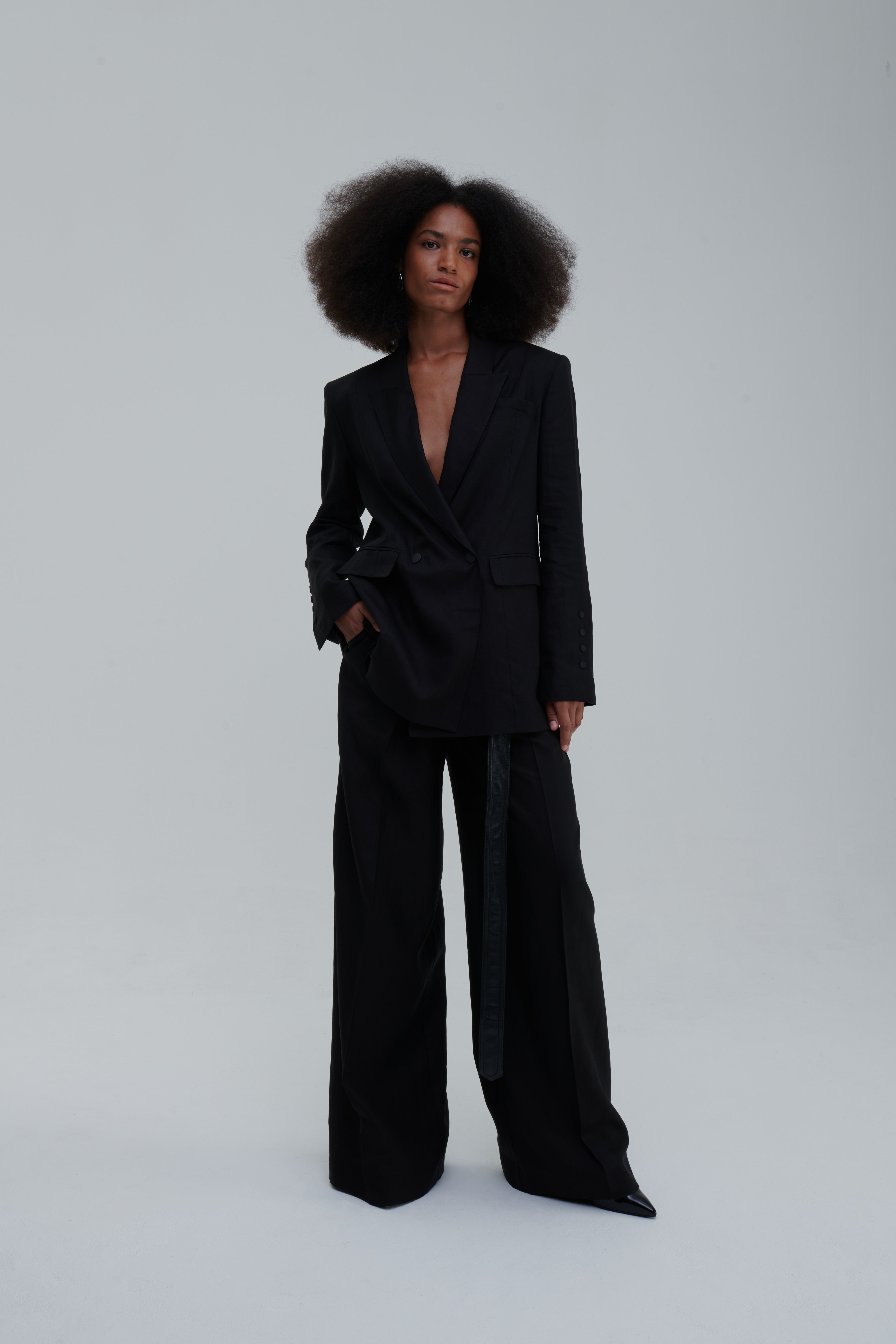 Black wide-leg trousers, back view drape