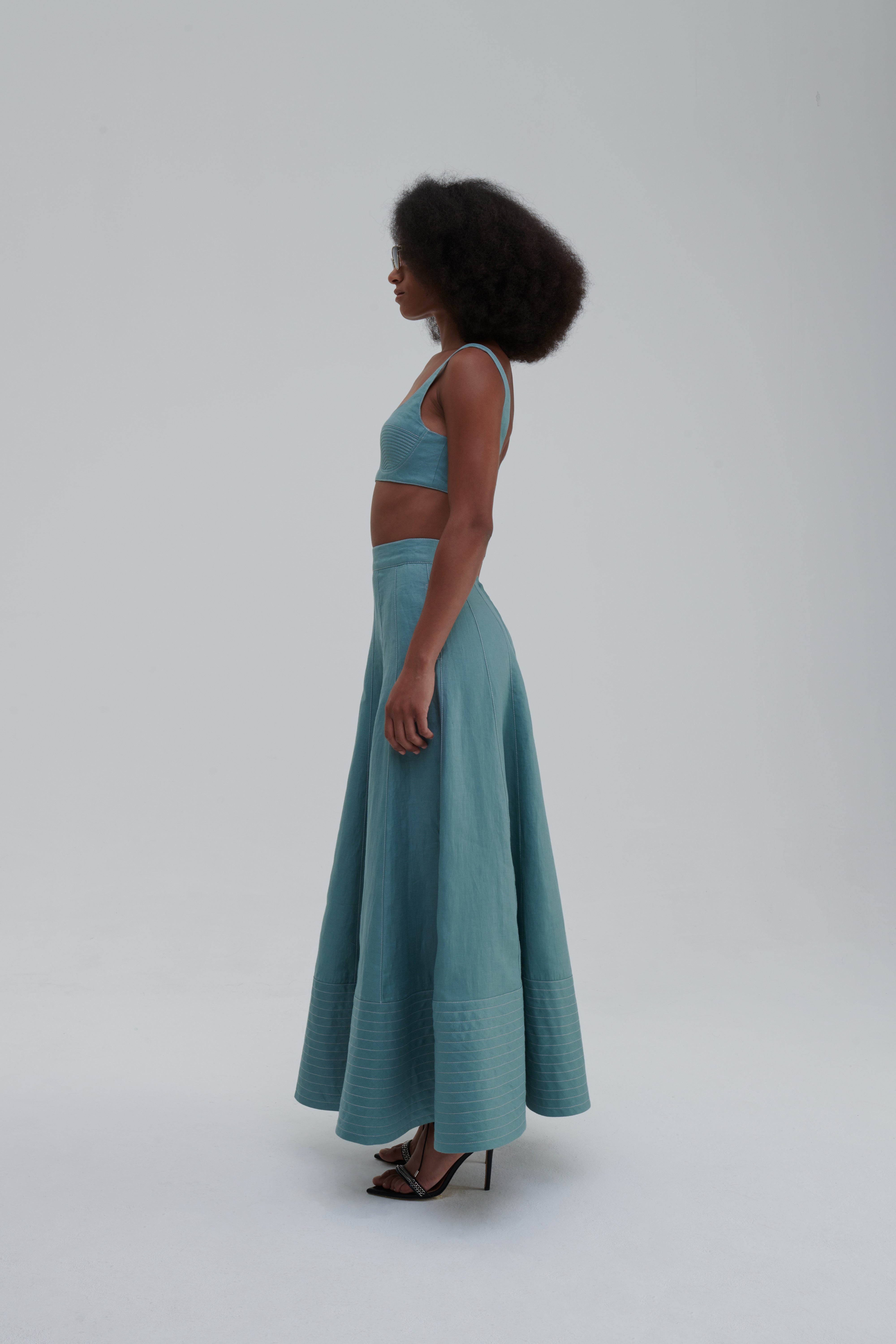 Green Bay linen maxi skirt with quilted hem, studio front packshot