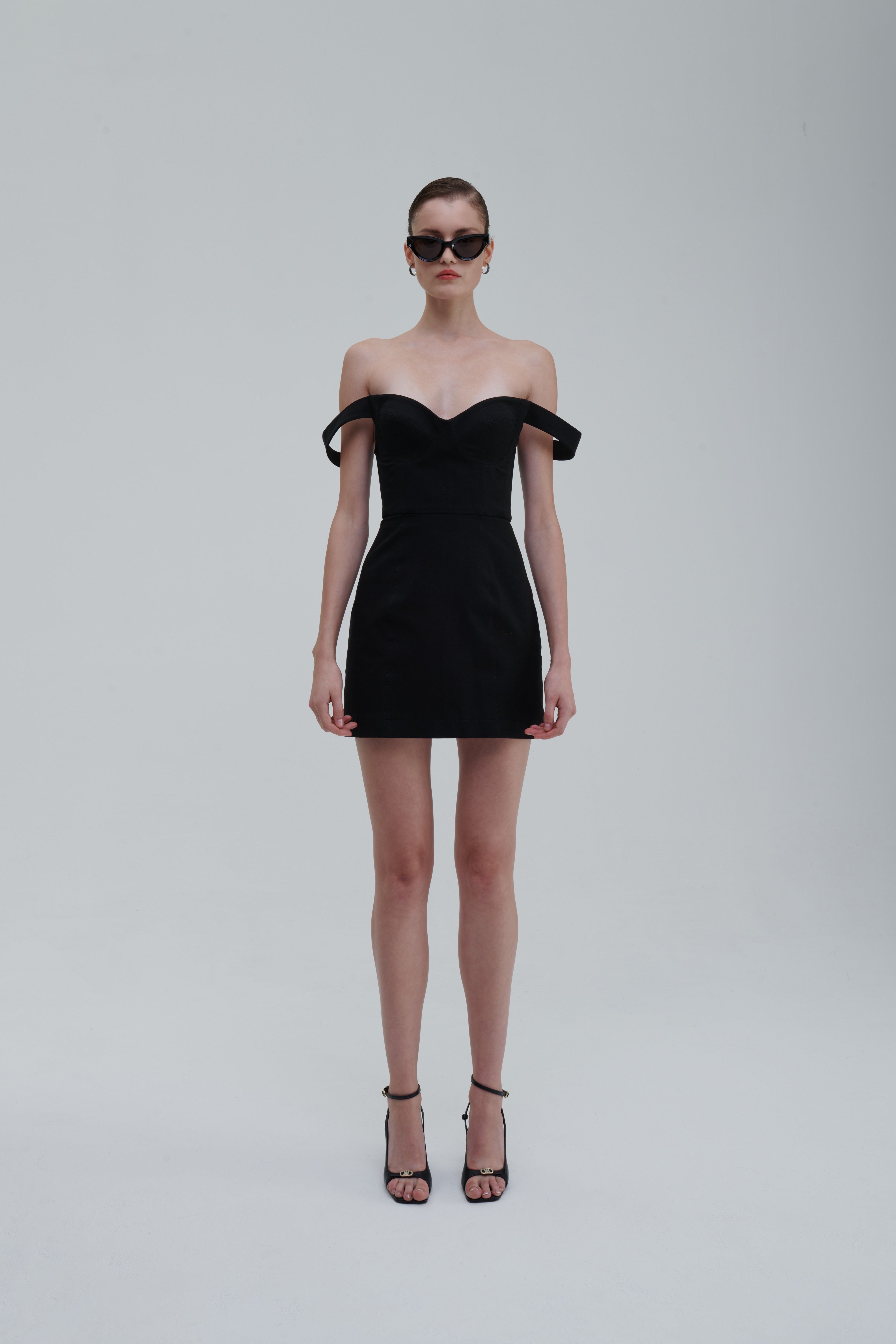 FALLING STRAPS DRESS by Sagio from the Spring/Summer 2025 collection — an asymmetrical black dress with layered falling straps, a fitted bodice, and deconstructed detailing. Bold conceptual eveningwear from thesagio.com.