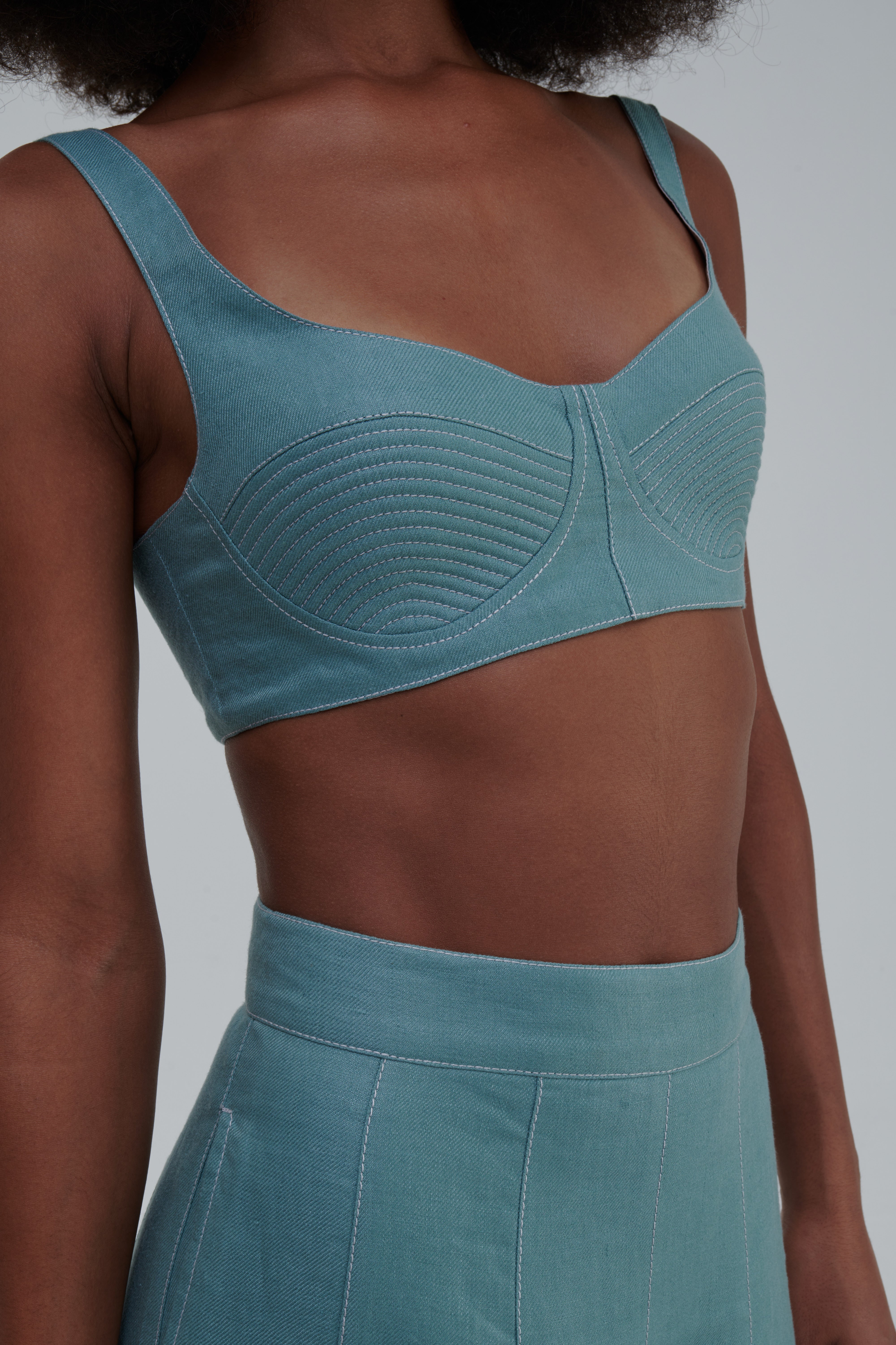 QUILTED BUSTIER TOP by Sagio from the Spring/Summer 2025 collection — a structured beige bustier top with subtle quilted detailing and clean, sculpted lines. Modern minimalist womenswear crafted from natural linen, available at thesagio.com
