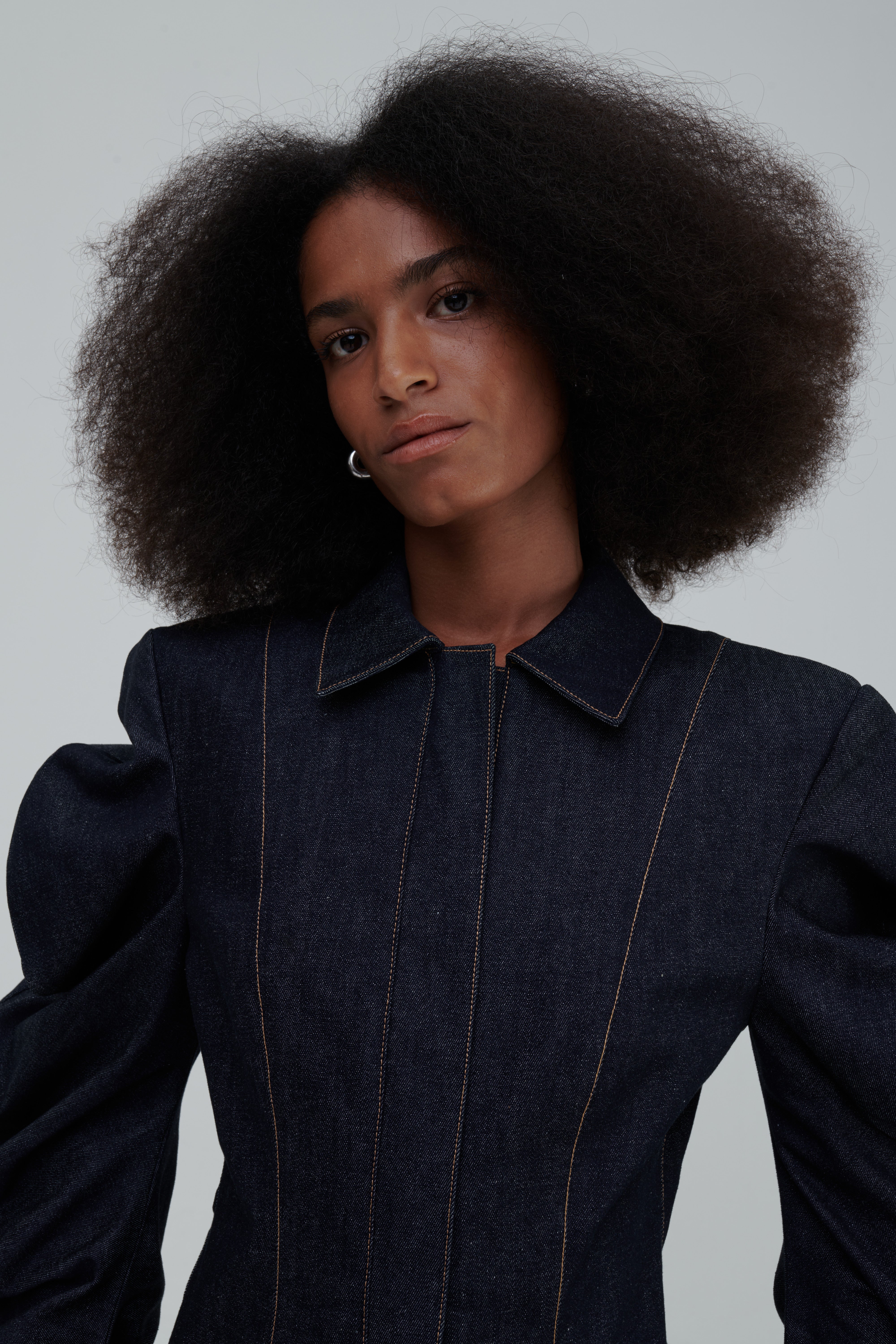 MEDUSA DENIM PARKA by Sagio from the Spring/Summer 2025 collection — a structured, sculptural denim parka with voluminous sleeves, architectural draping, and an avant-garde silhouette. Explore modern statement outerwear at thesagio.com