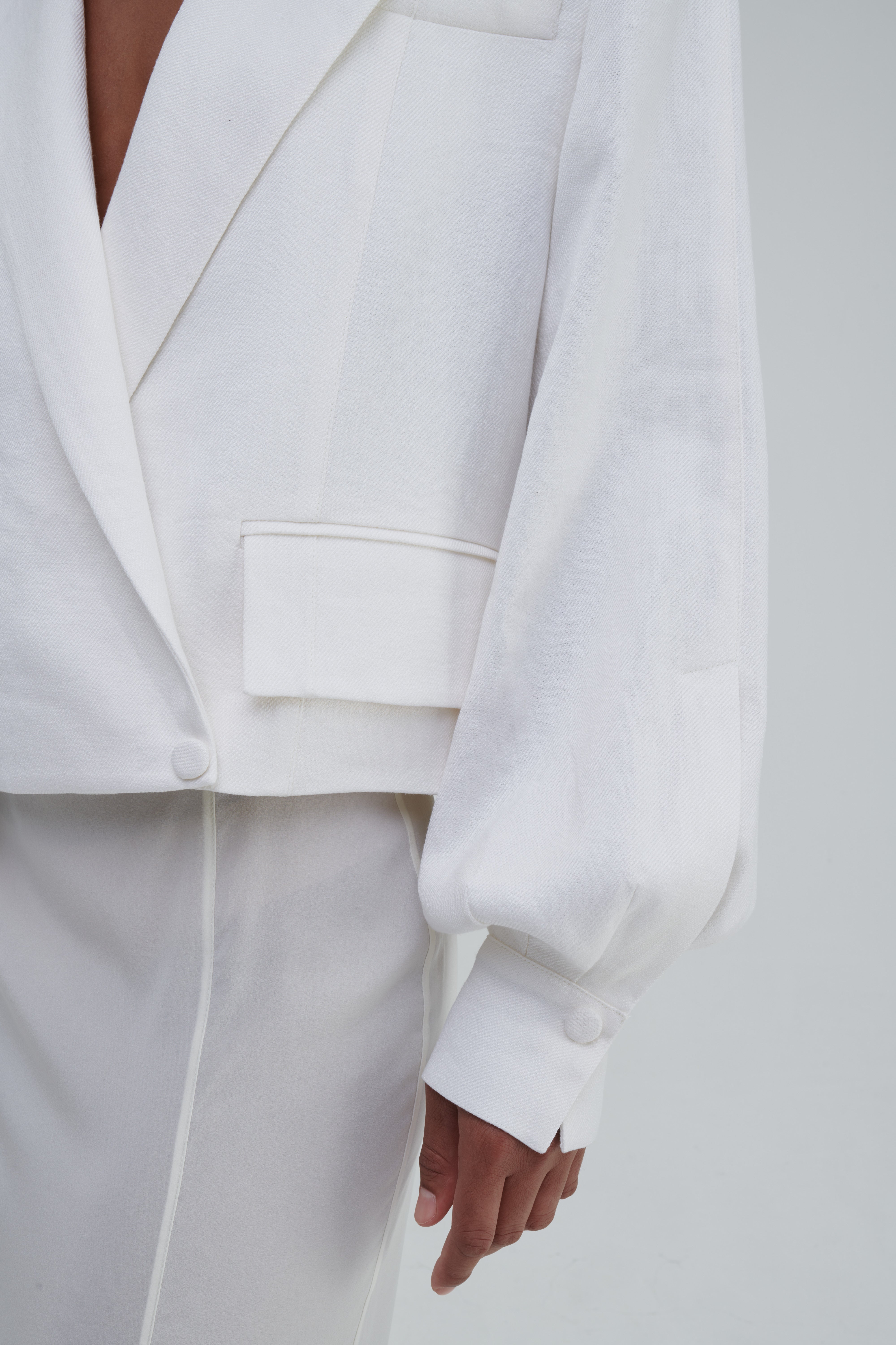 TRANSPARENT SILK SKIRT by Sagio from the Spring/Summer 2025 collection — a sheer, flowing silk maxi skirt in ivory white, designed with soft pleats and ethereal movement. Lightweight and elegant designer womenswear from thesagio.com