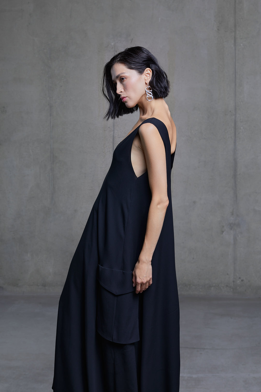 Black silk dress with cargo pockets