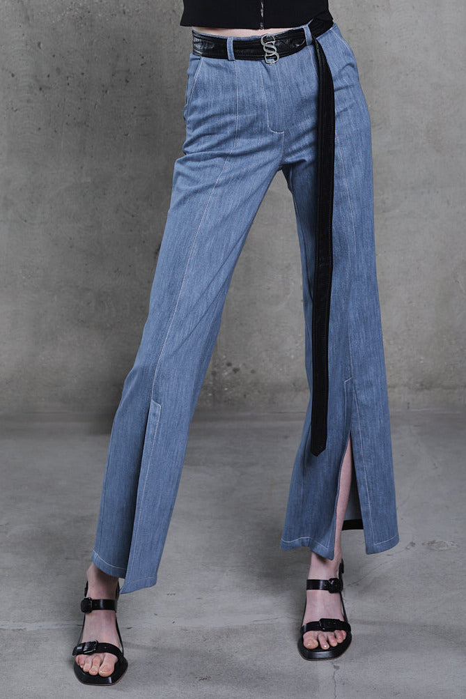 Detail close-up, frontal slit and denim texture, blue denim