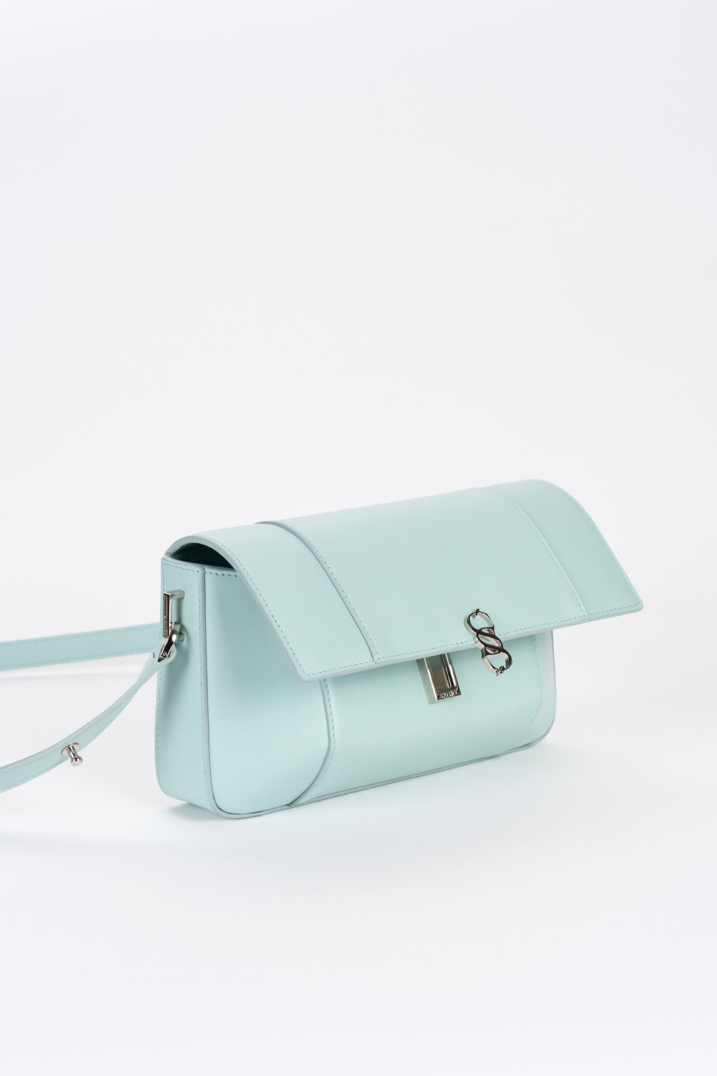 Clear aqua leather bag front view with structured shape and silver-tone logo detail