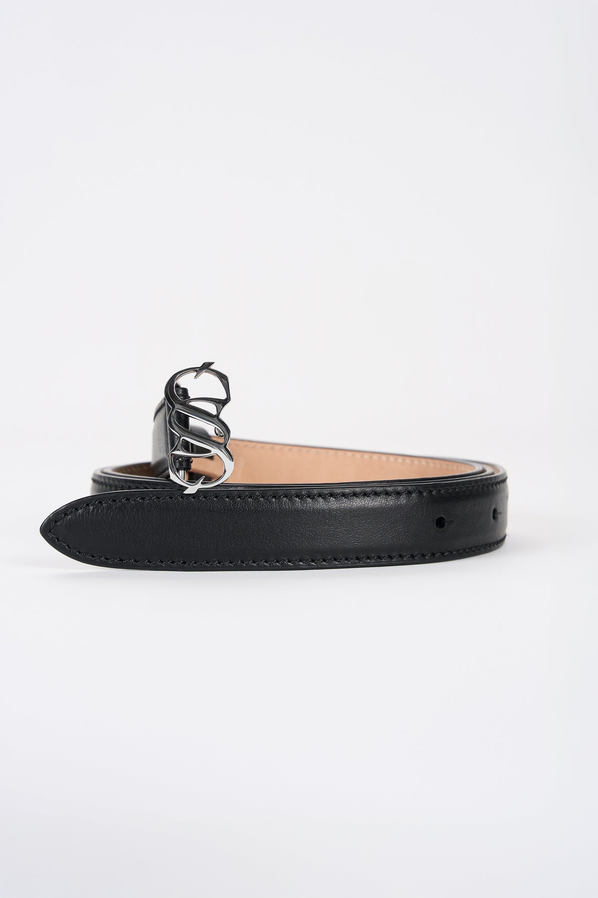 Black leather monogram belt with silver-tone buckle, angled view