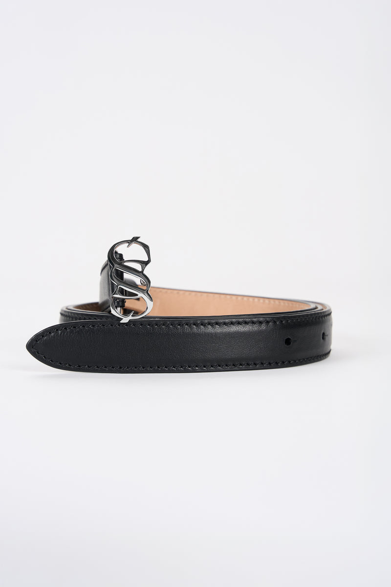 Black leather monogram belt with silver-tone buckle, angled view