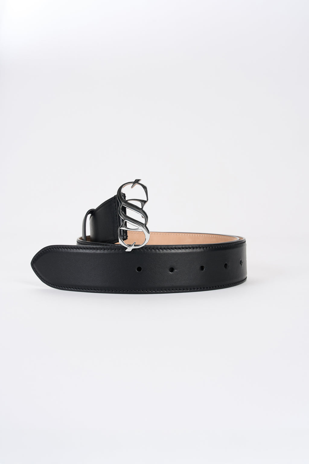 Black leather monogram belt with silver-tone buckle, angled view