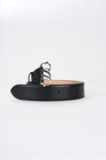 Black leather monogram belt with silver-tone buckle, angled view