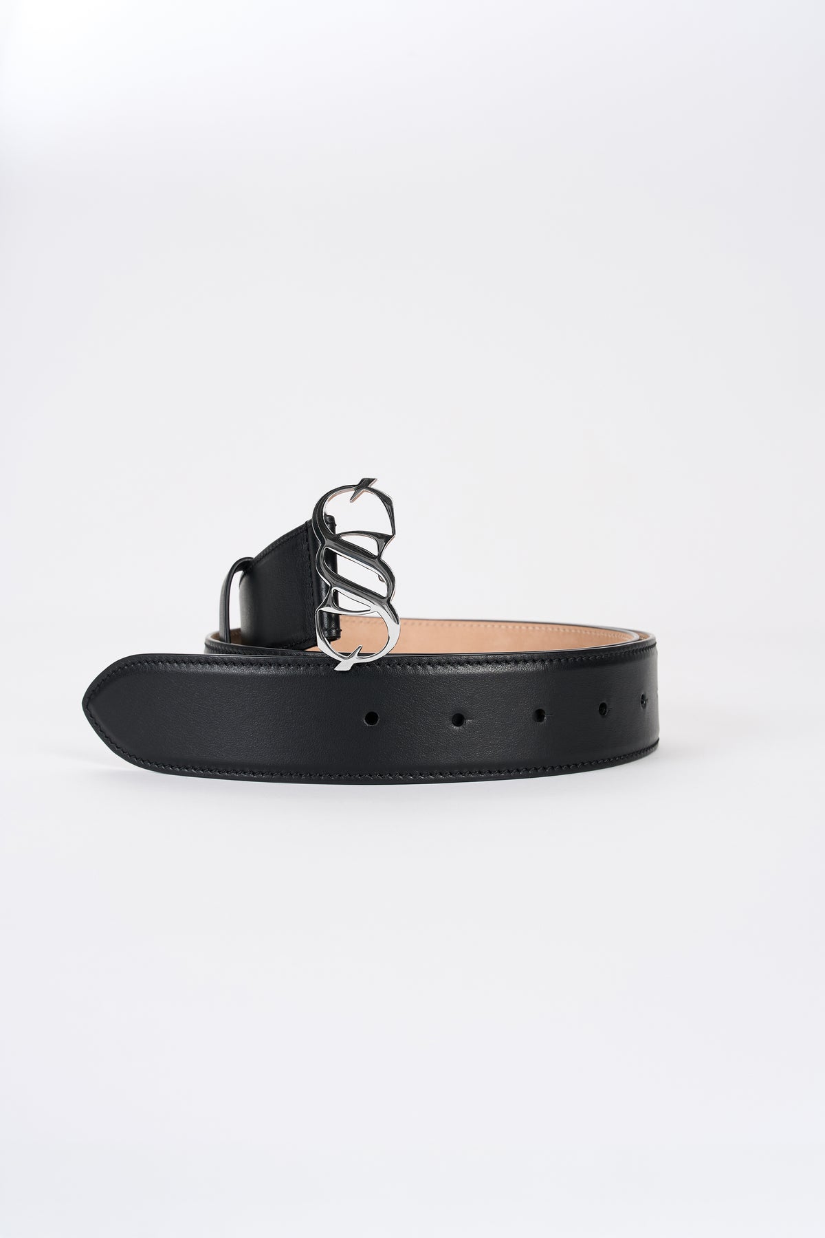 Black leather monogram belt with silver-tone buckle, angled view