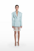 Transparent silk bermuda shorts in clear aqua, front view with sheer finish styled under a matching blazer