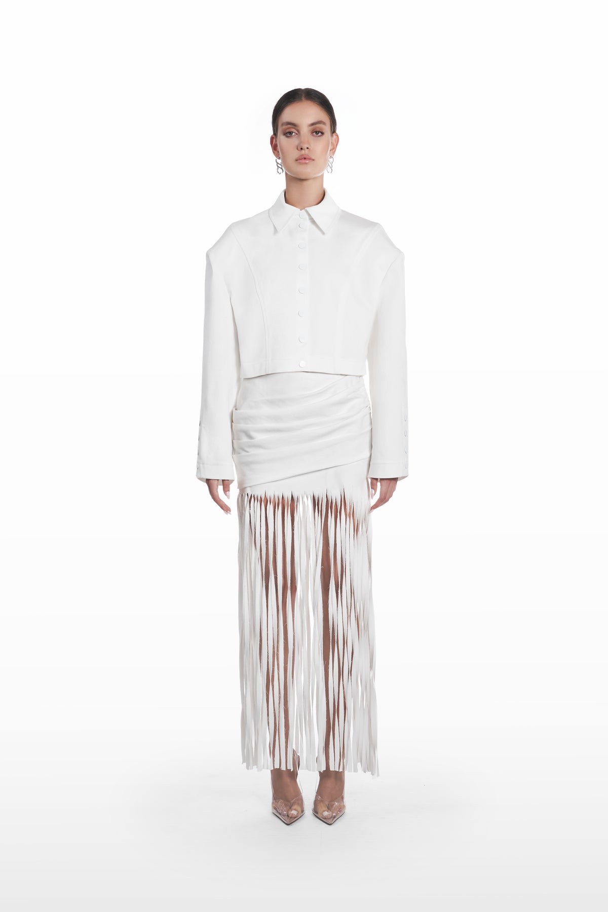 Palla Fringe Skirt in white, front view with draped waist and long fringe hem