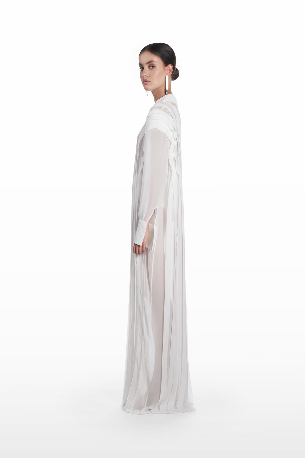 Long Transparent Plank Dress in White, side view, transparent silk evening dress with elongated drape, soft vertical paneling and cuffed sleeves