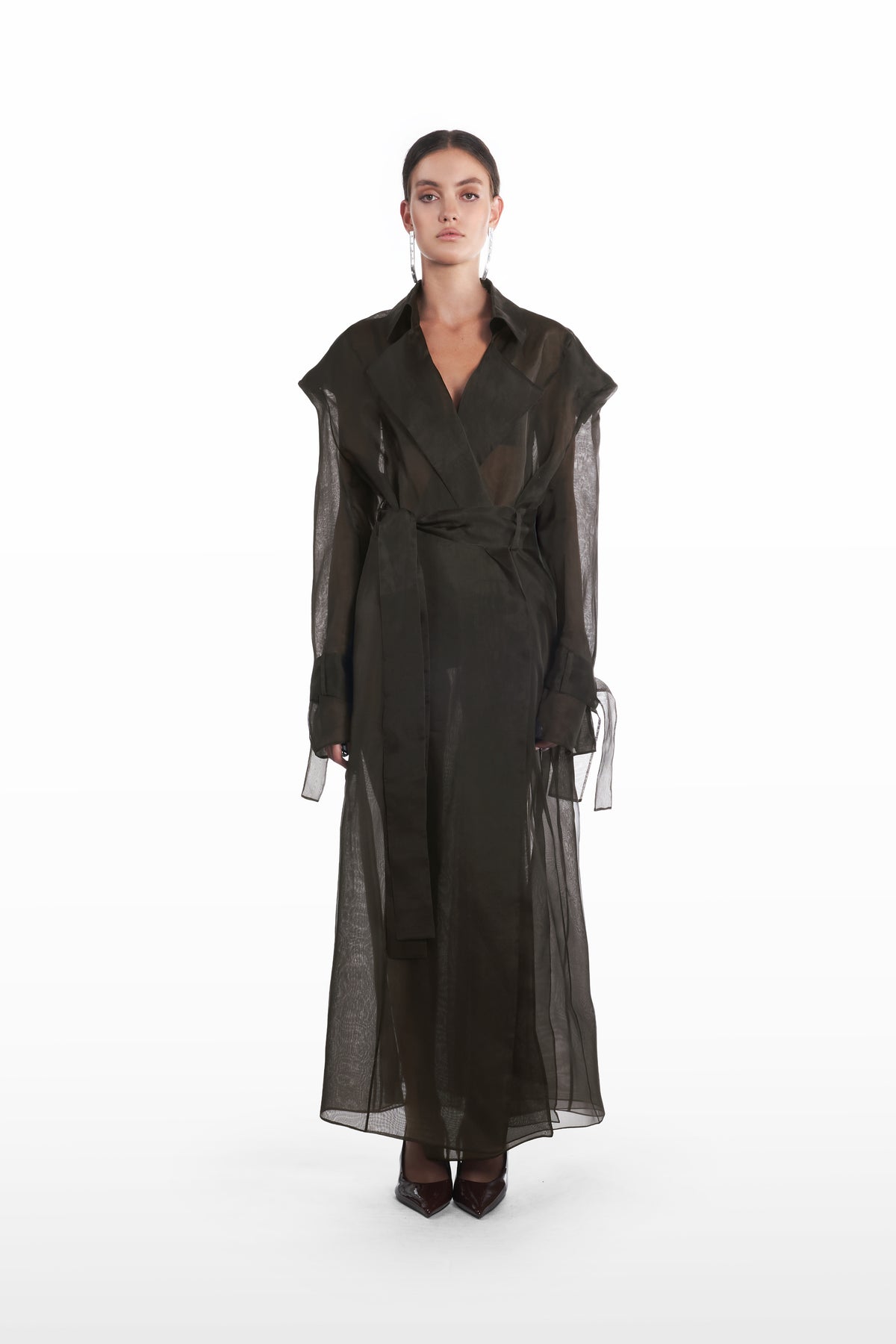 Classic double organza trench in black, front view with belted waist and sheer full-length silhouette