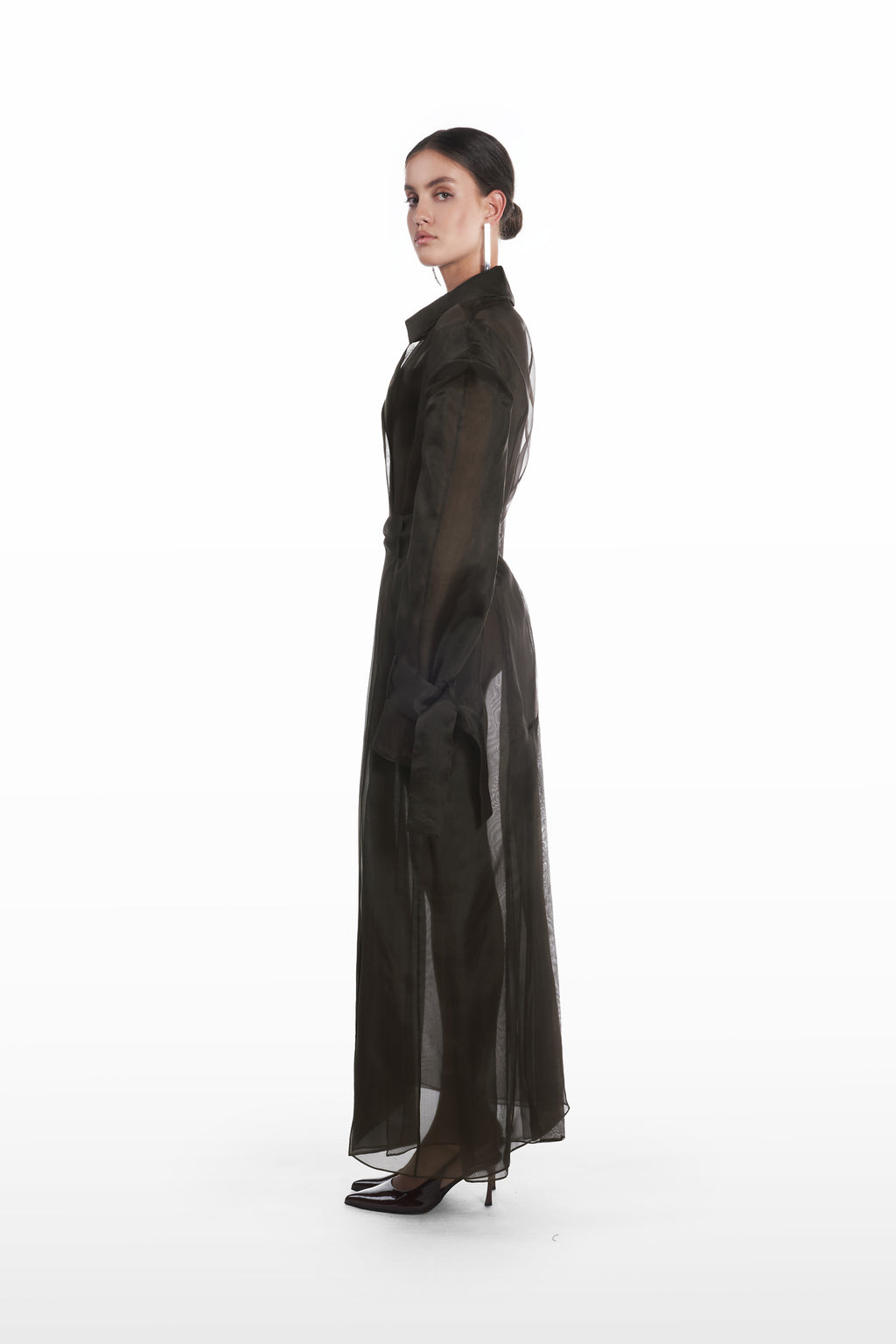 Classic double organza trench in black, side view with fluid transparent silhouette and tied cuffs