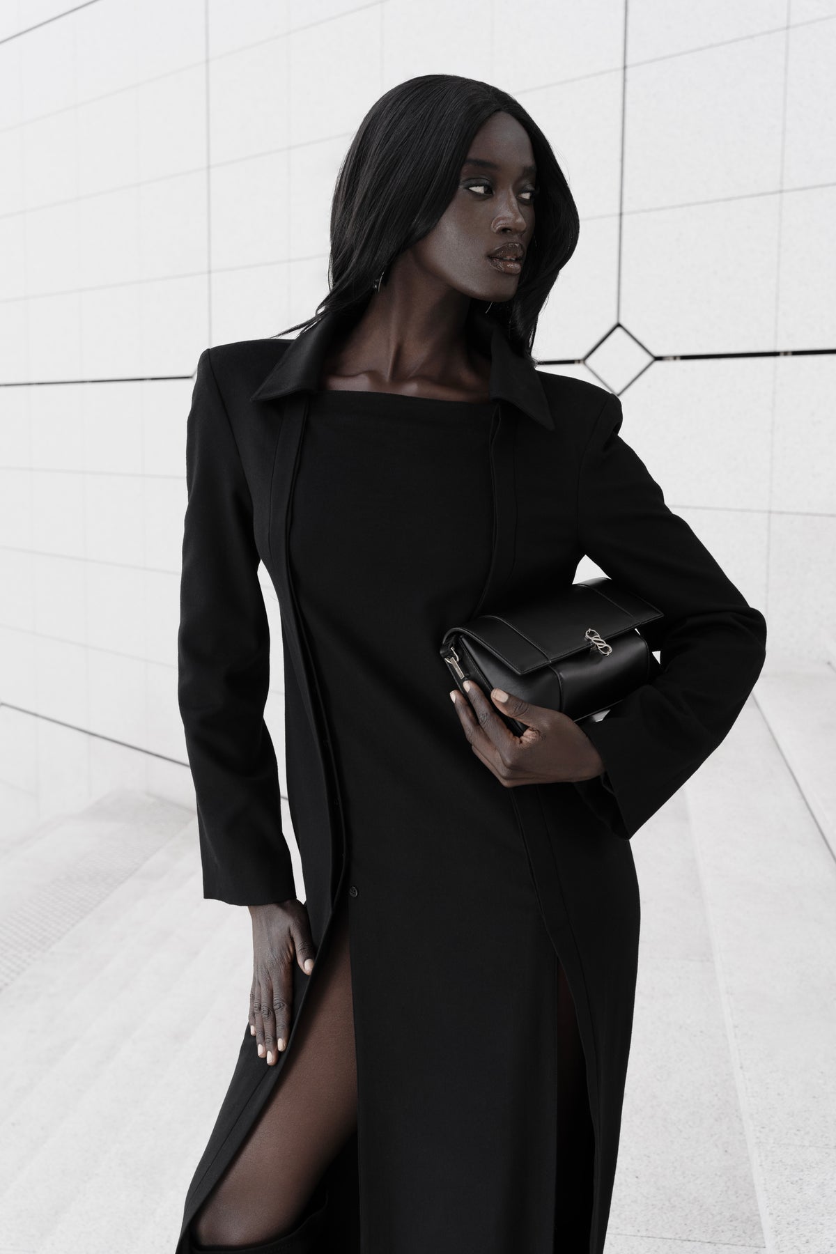 Black Il Cupola bag styled with a black tailored look, carried under the arm