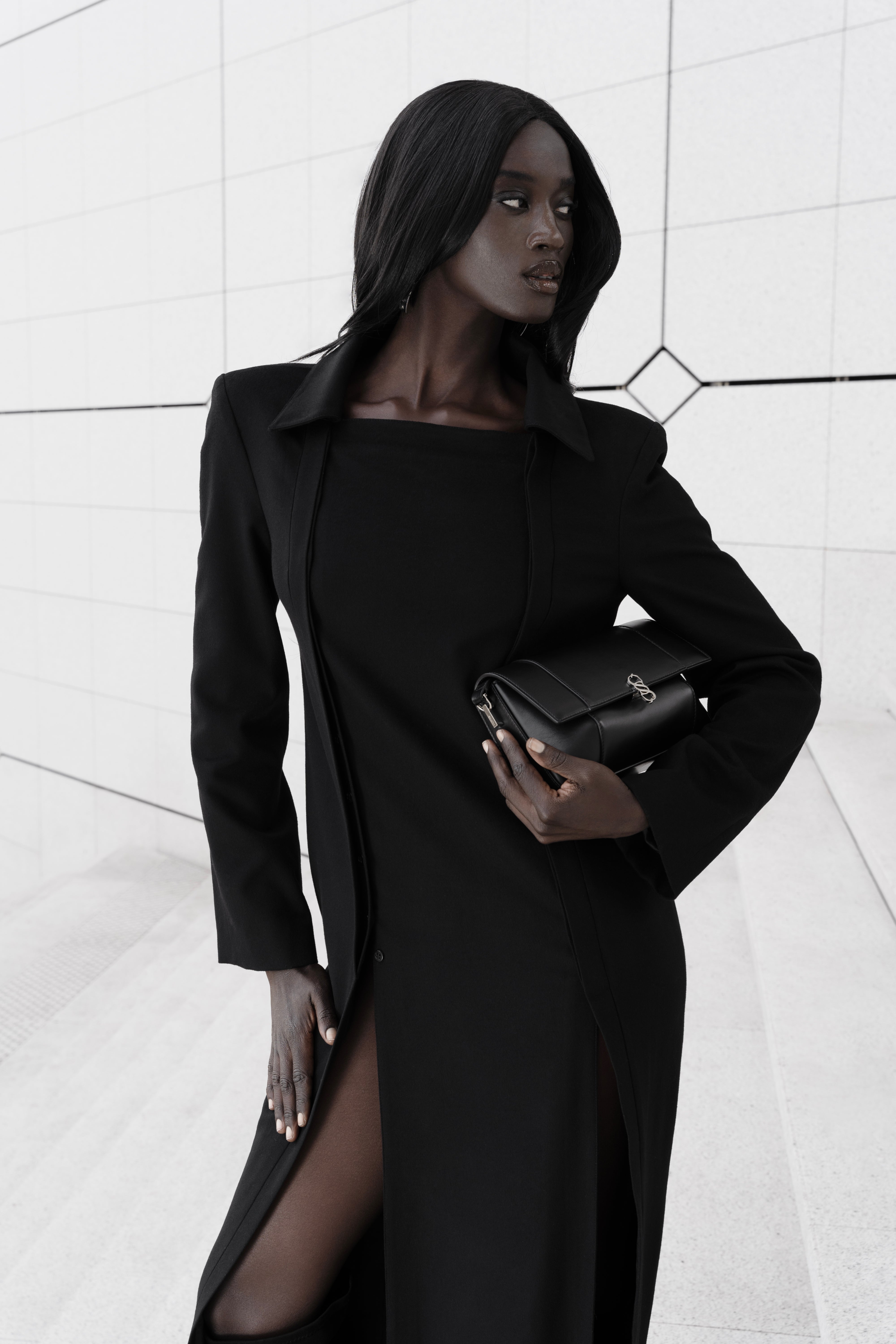 Black Il Cupola bag styled with a black tailored look, carried under the arm
