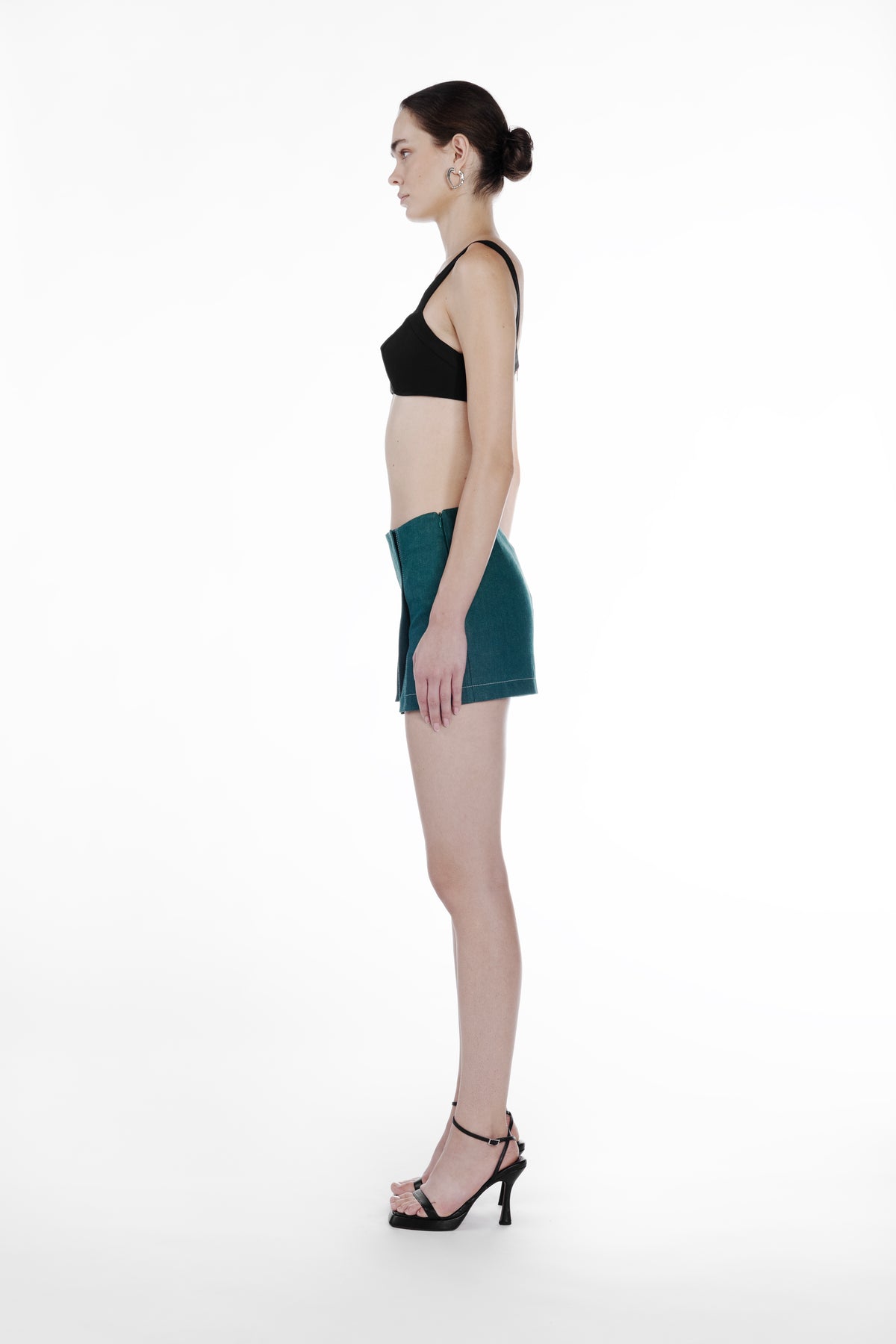 Mini Slits Shorts in Emerald Green, side view, fitted cotton mini shorts with clean low-rise waist, subtle front slit and structured tailored silhouette