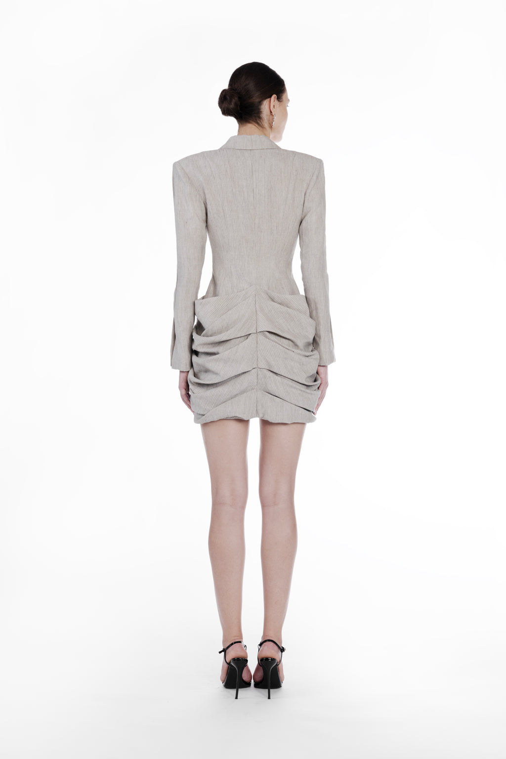 Falling Folds Stripes Dress cold beige back view with structured shoulders and layered folded mini skirt
