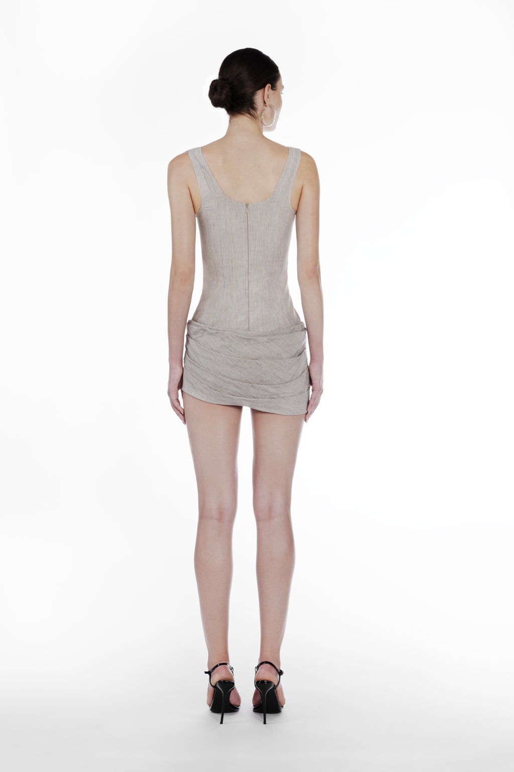 Linen Stripes Bodydress in cold beige, back view of the sleeveless striped mini dress with fitted silhouette and draped skirt detail